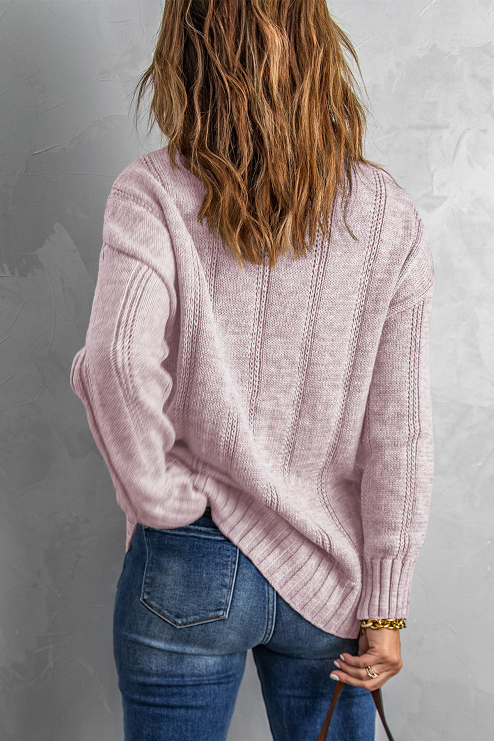 A cozy pink oversize thick pullover sweater with a cable knit design, perfect for winter wear.