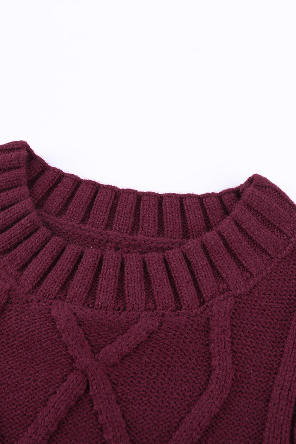 A cozy pink oversize thick pullover sweater with a cable knit design, perfect for winter wear.