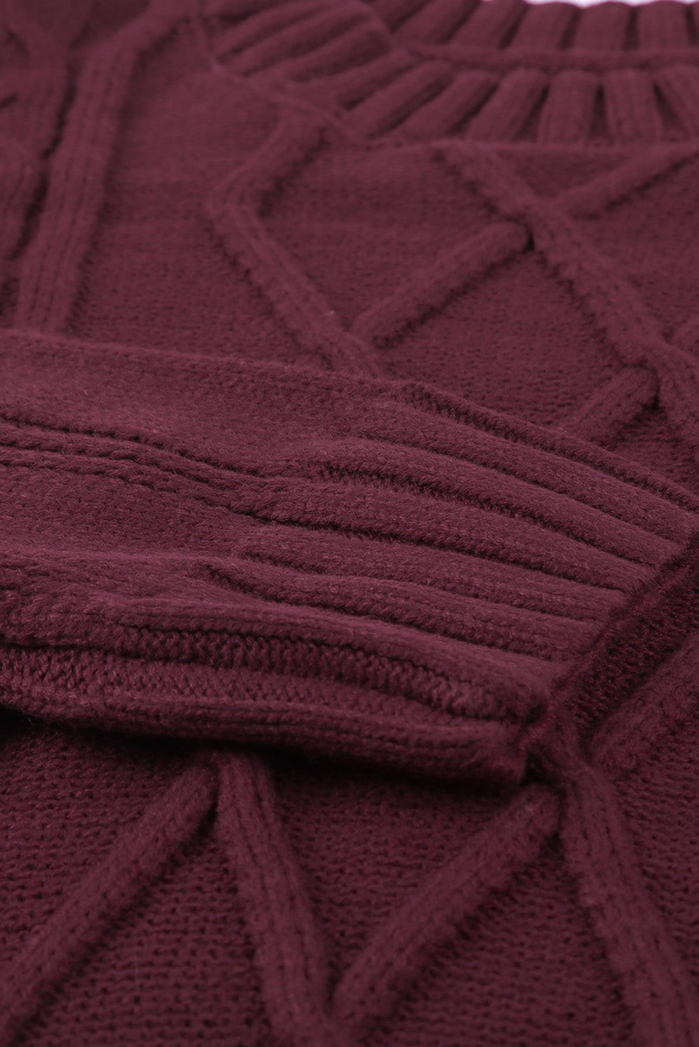 A cozy pink oversize thick pullover sweater with a cable knit design, perfect for winter wear.