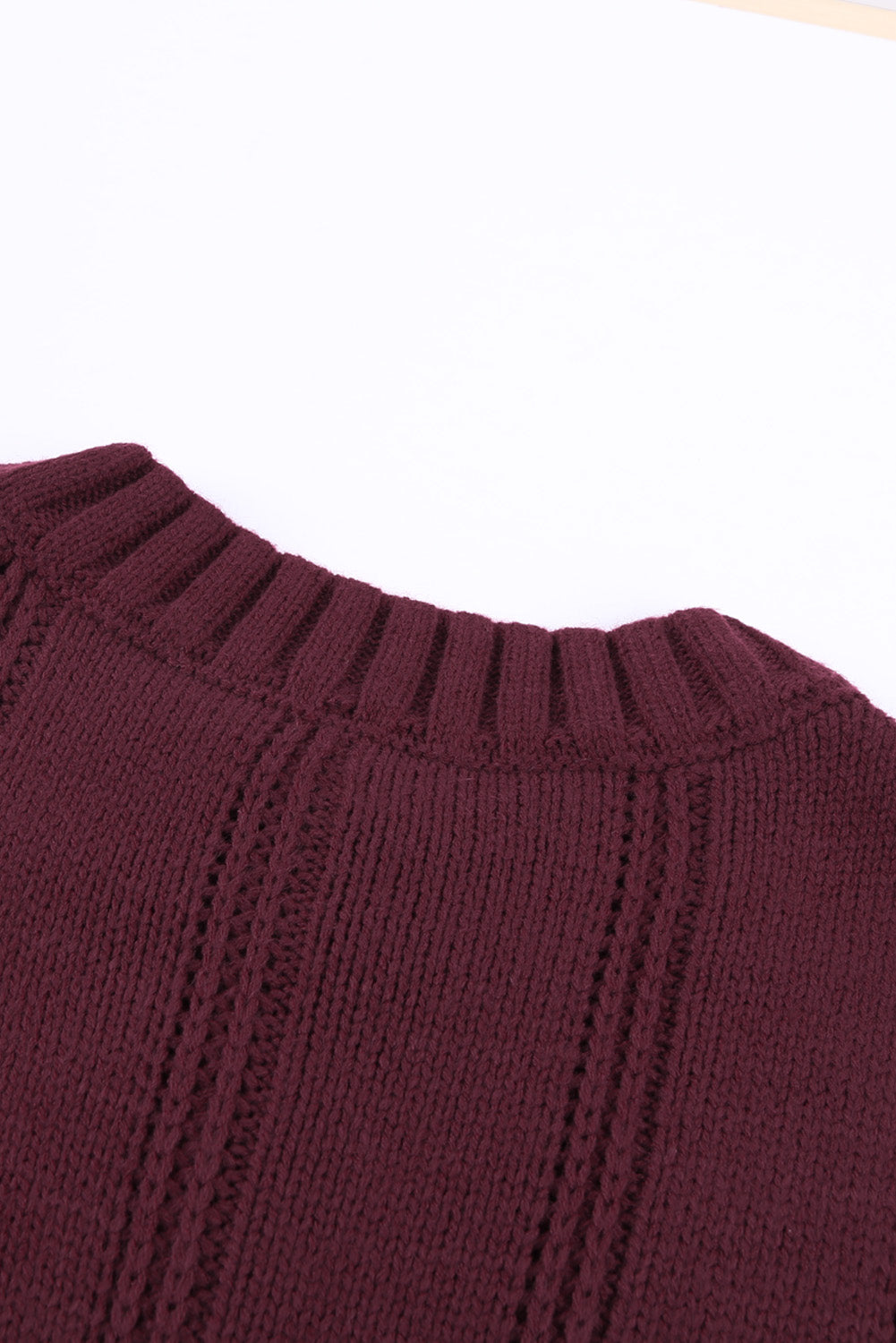 A cozy pink oversize thick pullover sweater with a cable knit design, perfect for winter wear.