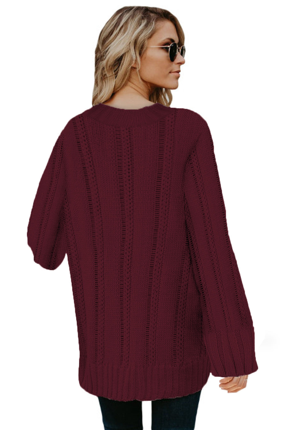 A cozy pink oversize thick pullover sweater with a cable knit design, perfect for winter wear.