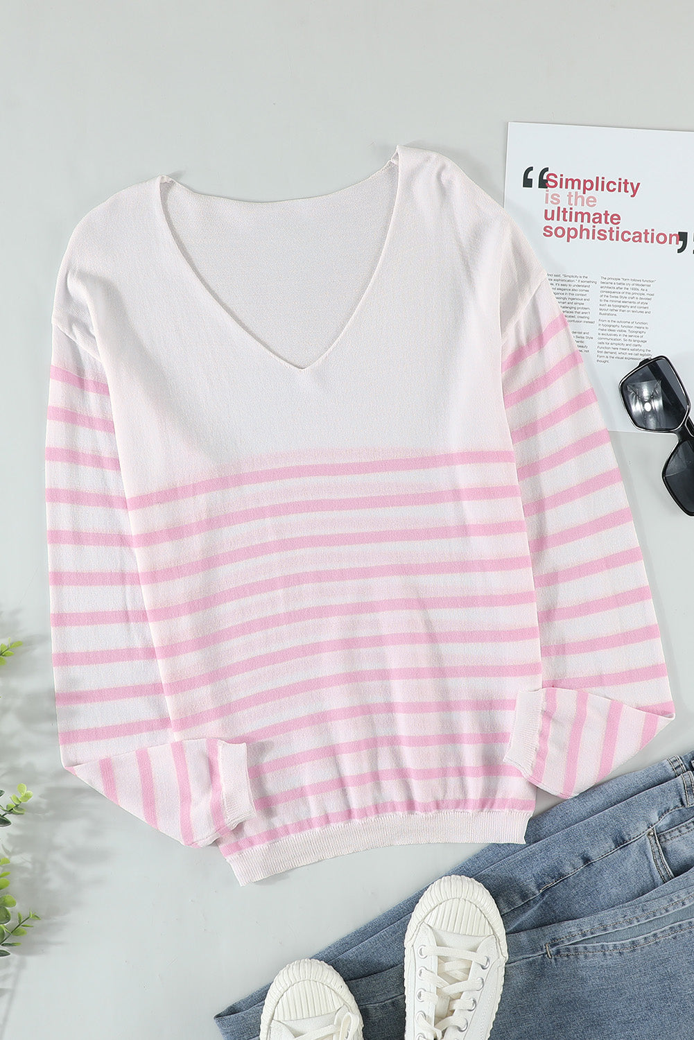 A stylish pink striped V neck long sleeve sweater displayed on a mannequin, showcasing its casual and chic design.