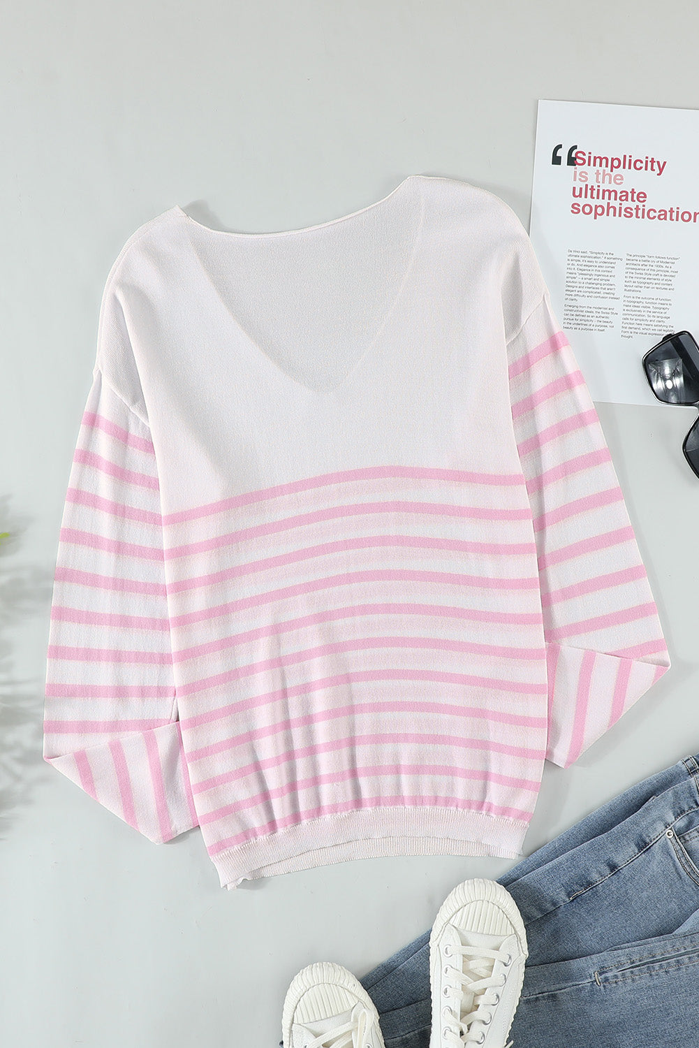 A stylish pink striped V neck long sleeve sweater displayed on a mannequin, showcasing its casual and chic design.