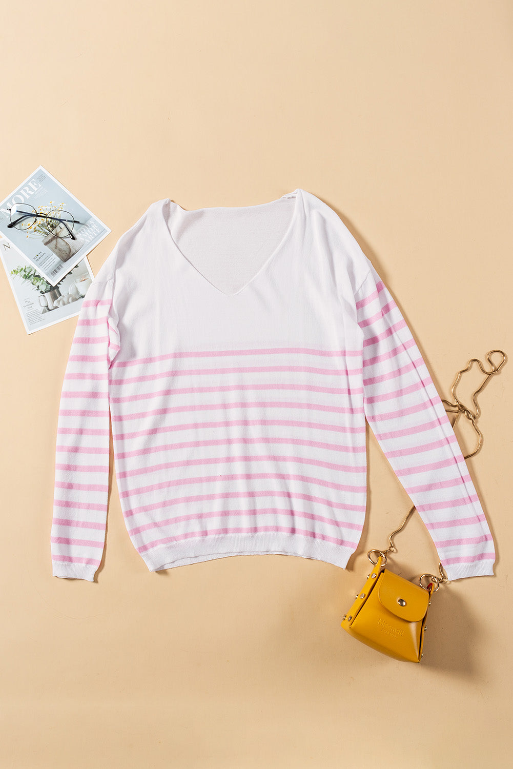 A stylish pink striped V neck long sleeve sweater displayed on a mannequin, showcasing its casual and chic design.