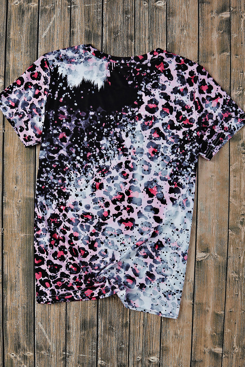 A stylish pink tie dye graphic tee featuring a leopard and eagle design, perfect for casual wear.