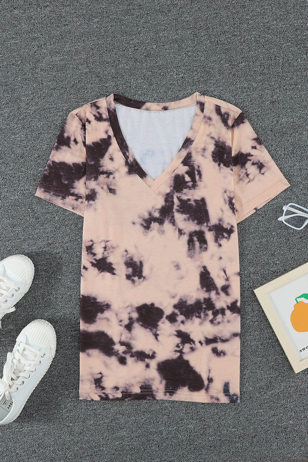 A stylish pink tie-dye V neck t-shirt for women, showcasing a vibrant and trendy design perfect for summer wear.