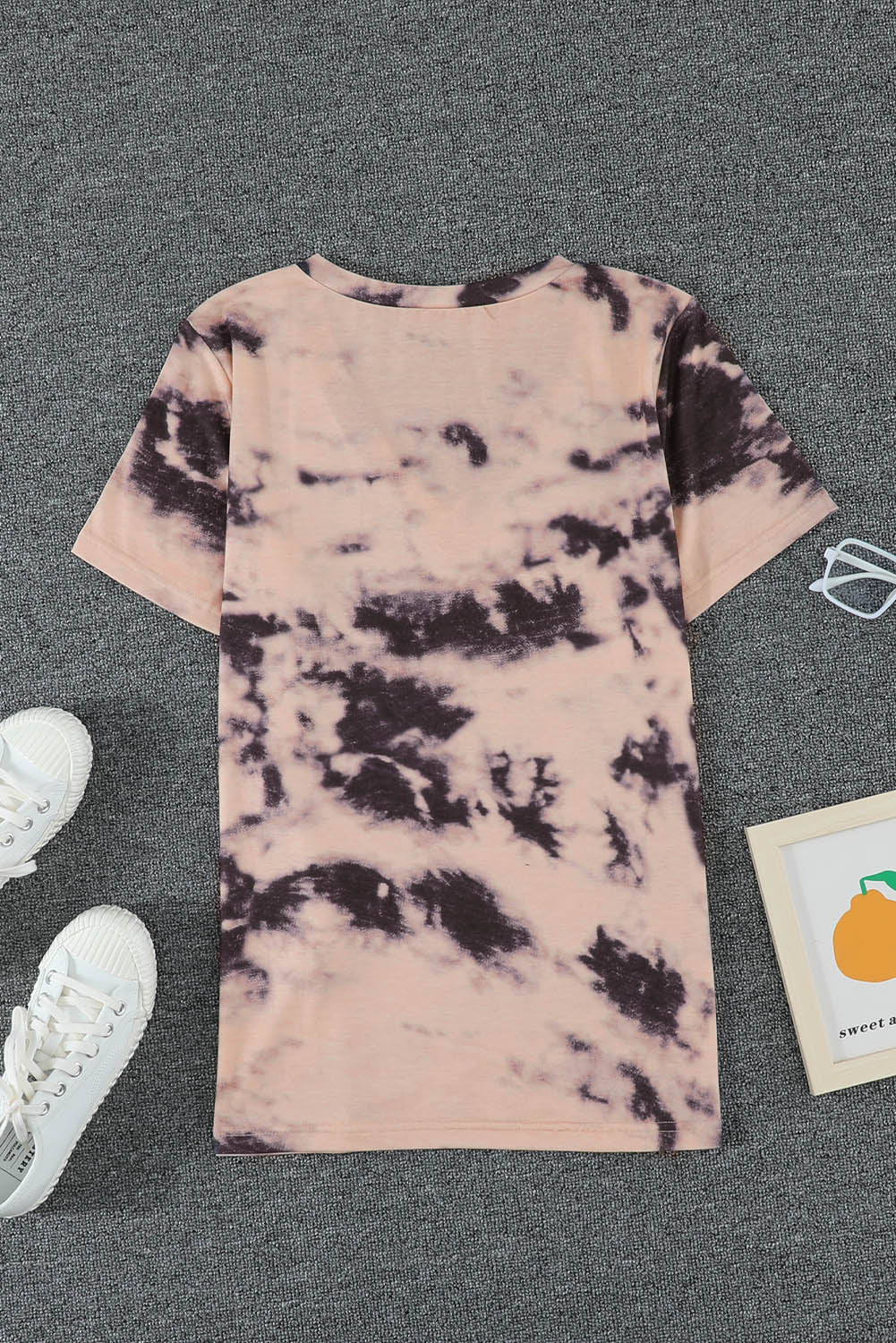 A stylish pink tie-dye V neck t-shirt for women, showcasing a vibrant and trendy design perfect for summer wear.