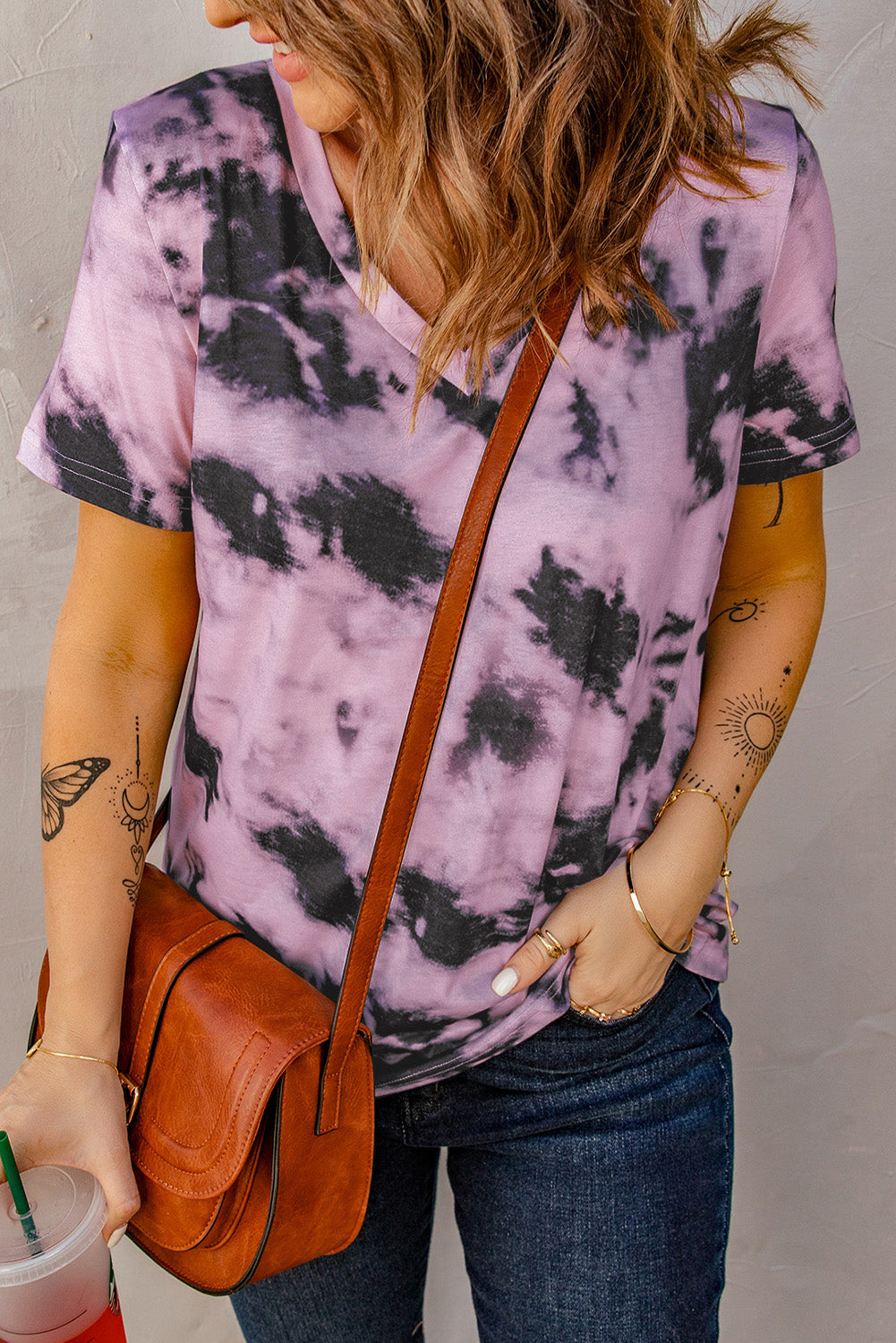 A stylish pink tie-dye V neck t-shirt for women, showcasing a vibrant and trendy design perfect for summer wear.