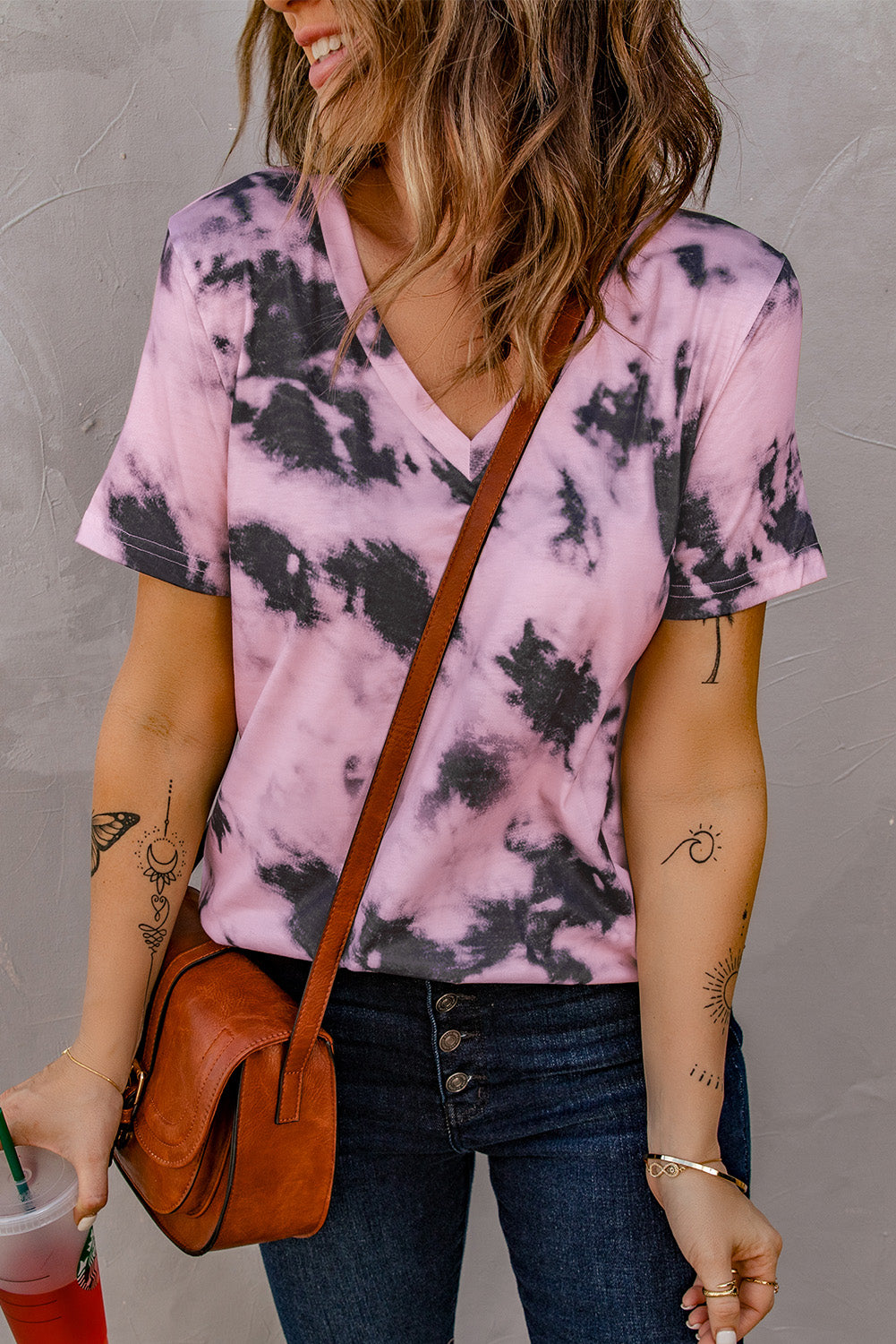 A stylish pink tie-dye V neck t-shirt for women, showcasing a vibrant and trendy design perfect for summer wear.