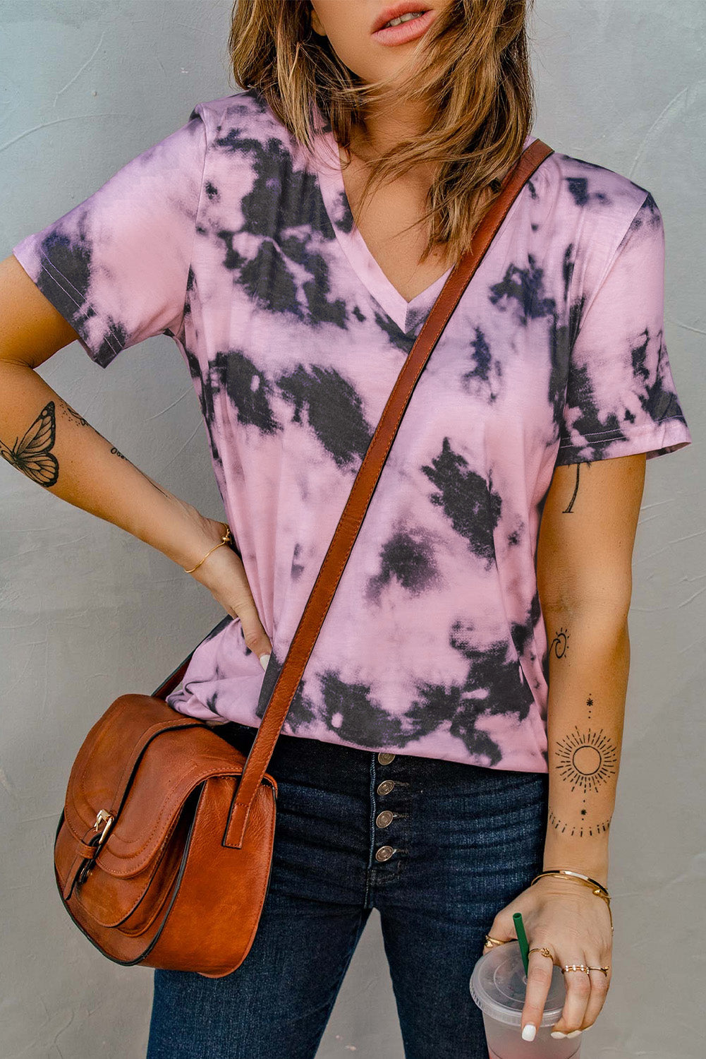 A stylish pink tie-dye V neck t-shirt for women, showcasing a vibrant and trendy design perfect for summer wear.