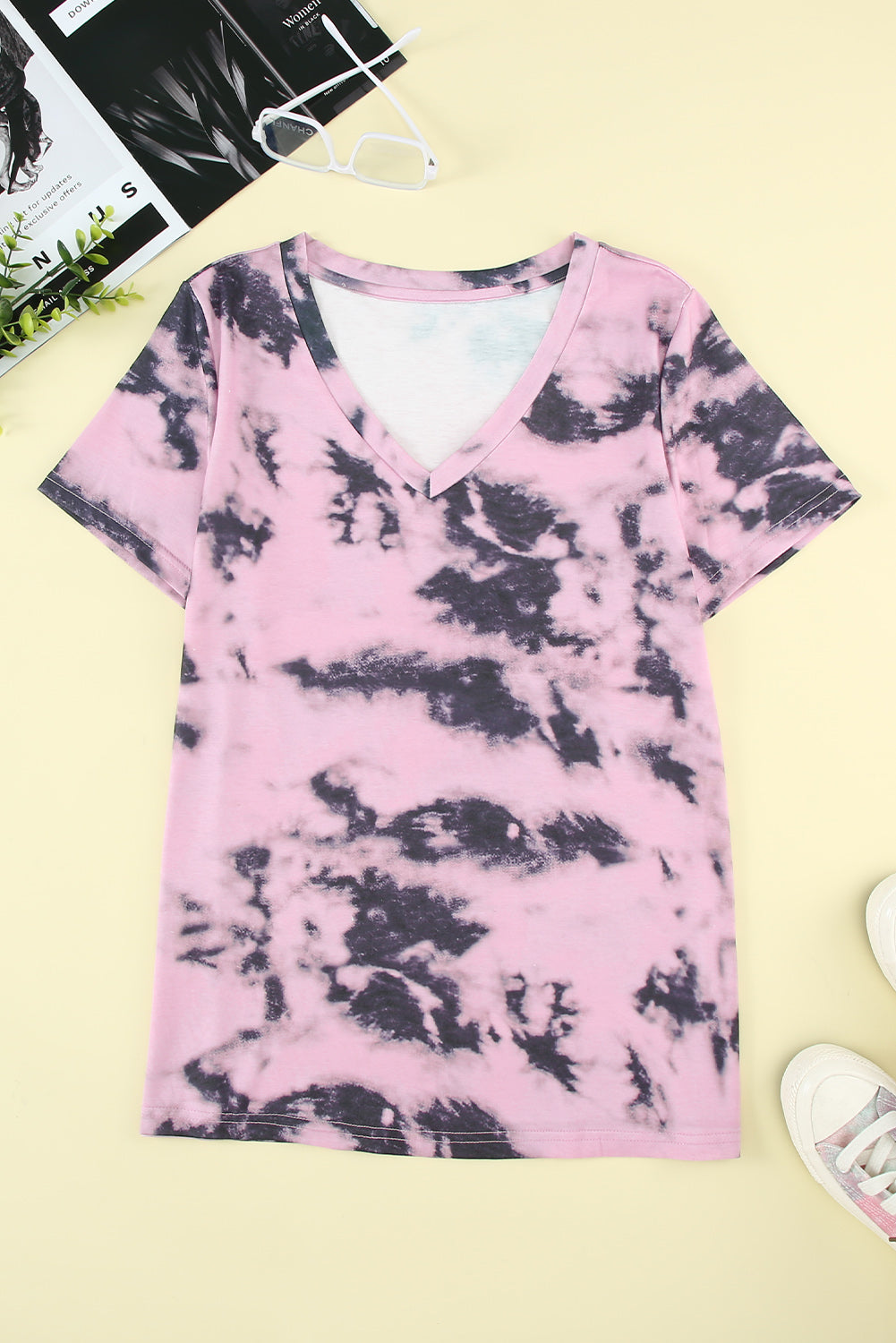 A stylish pink tie-dye V neck t-shirt for women, showcasing a vibrant and trendy design perfect for summer wear.