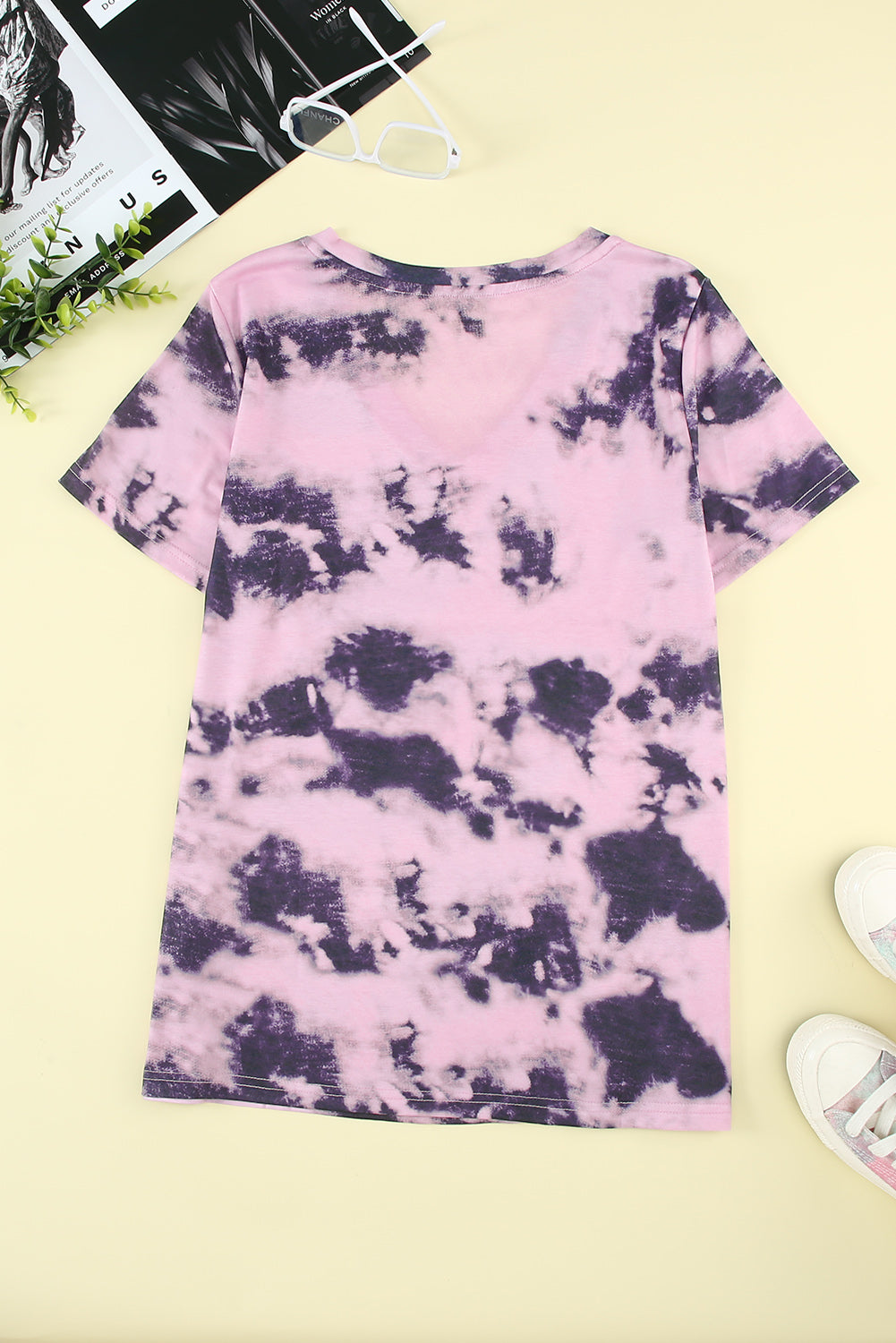 A stylish pink tie-dye V neck t-shirt for women, showcasing a vibrant and trendy design perfect for summer wear.