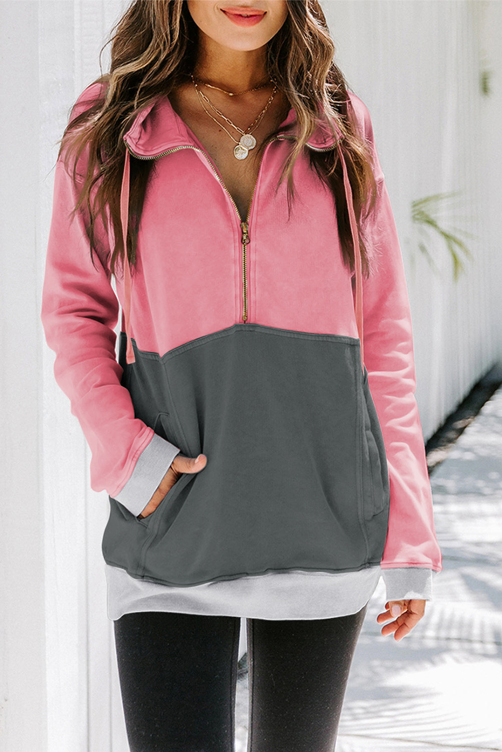 A stylish pink zipped colorblock sweatshirt with pockets, featuring a turn-down collar and a fashionable design, perfect for women.