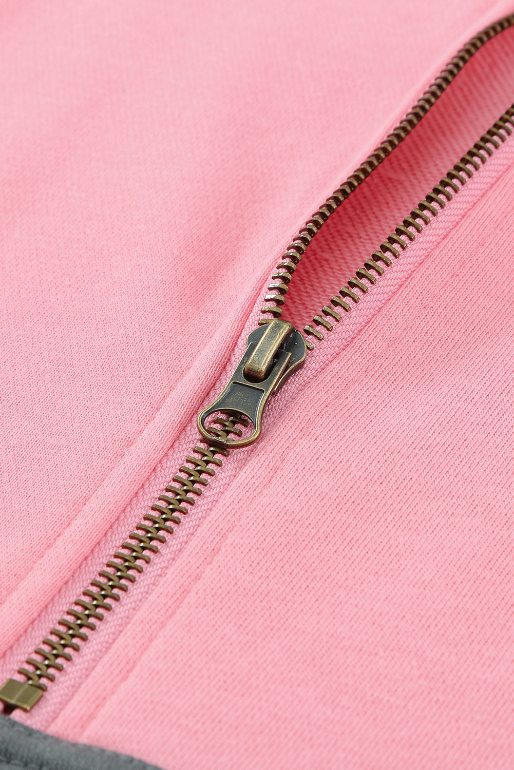 A stylish pink zipped colorblock sweatshirt with pockets, featuring a turn-down collar and a fashionable design, perfect for women.