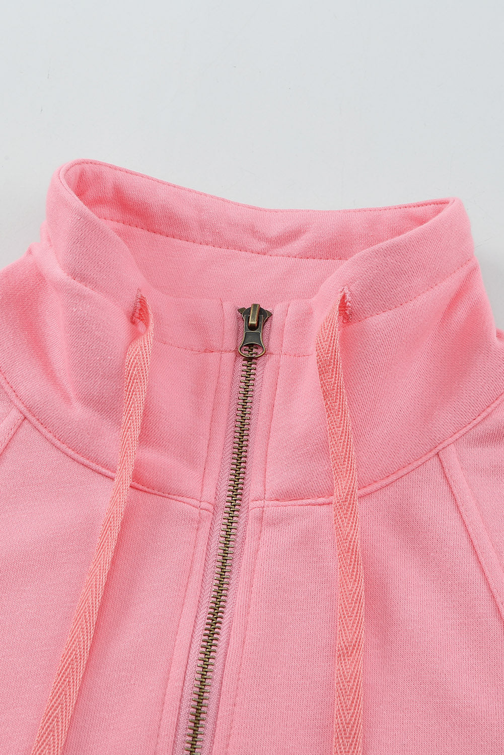 A stylish pink zipped colorblock sweatshirt with pockets, featuring a turn-down collar and a fashionable design, perfect for women.