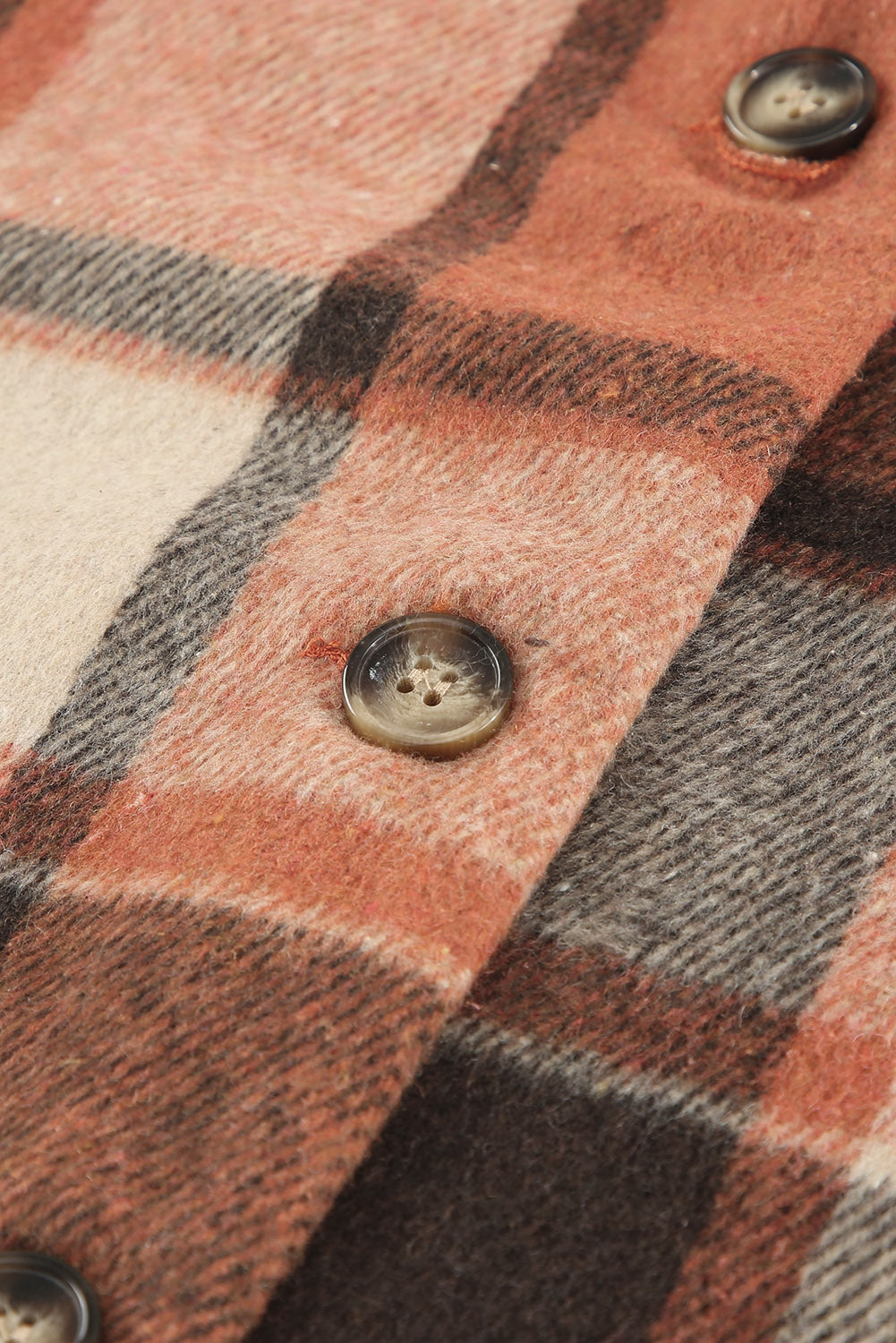 A stylish plaid print buttoned shirt jacket in warm tones, showcasing its soft fabric and button closure design.