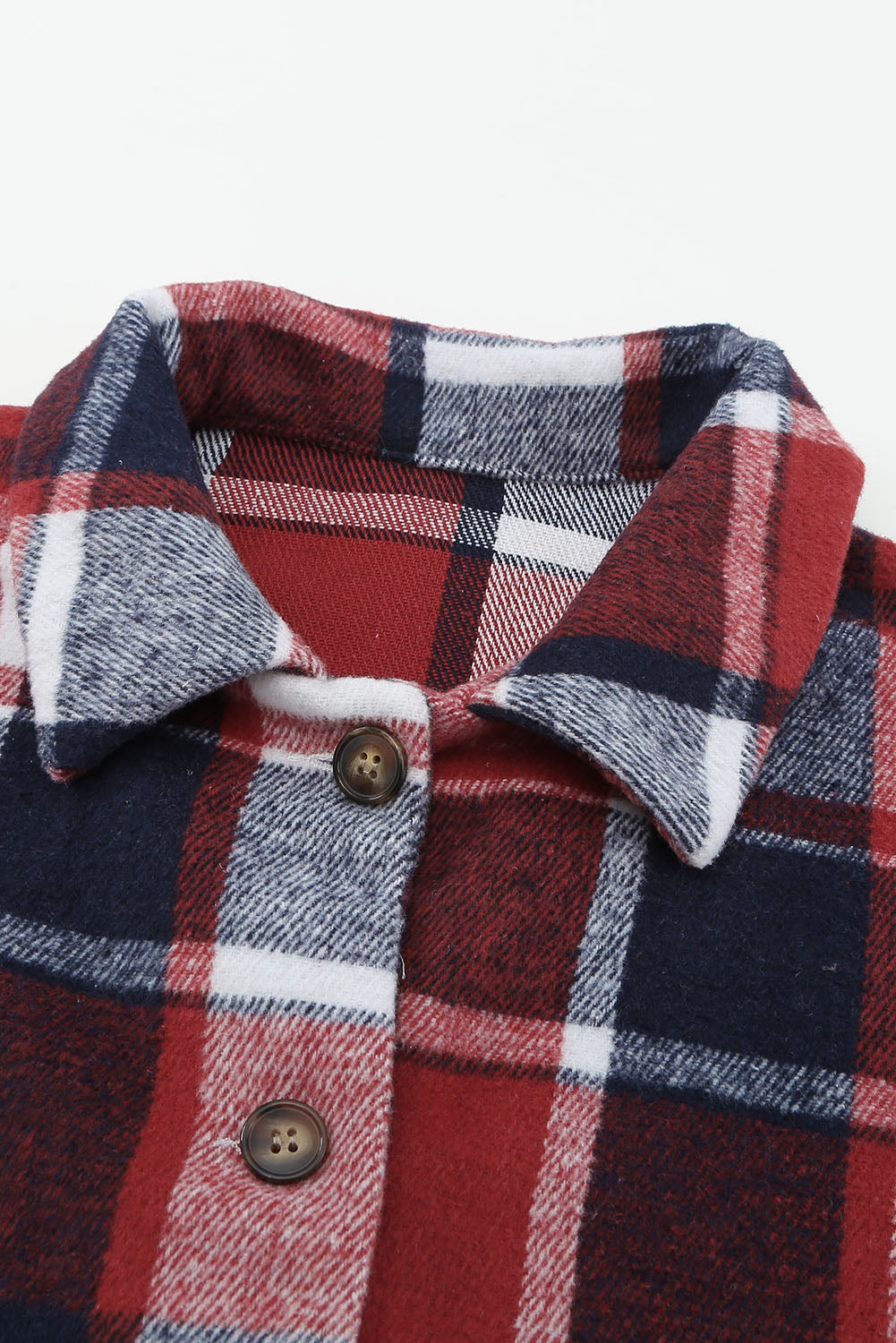 A stylish plaid print buttoned shirt jacket in warm tones, showcasing its soft fabric and button closure design.