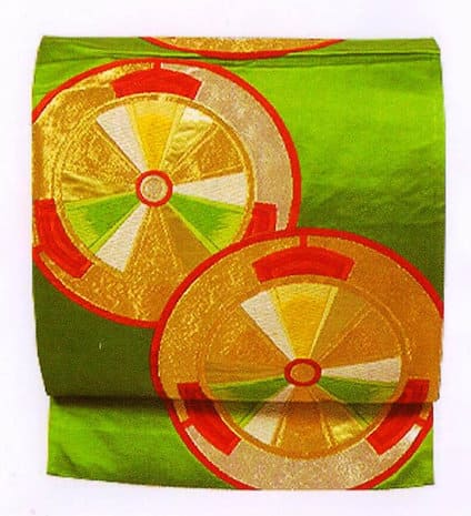 Pochette Roues, a unique embroidered silk pouch from Japan, showcasing intricate designs and versatile wear options.