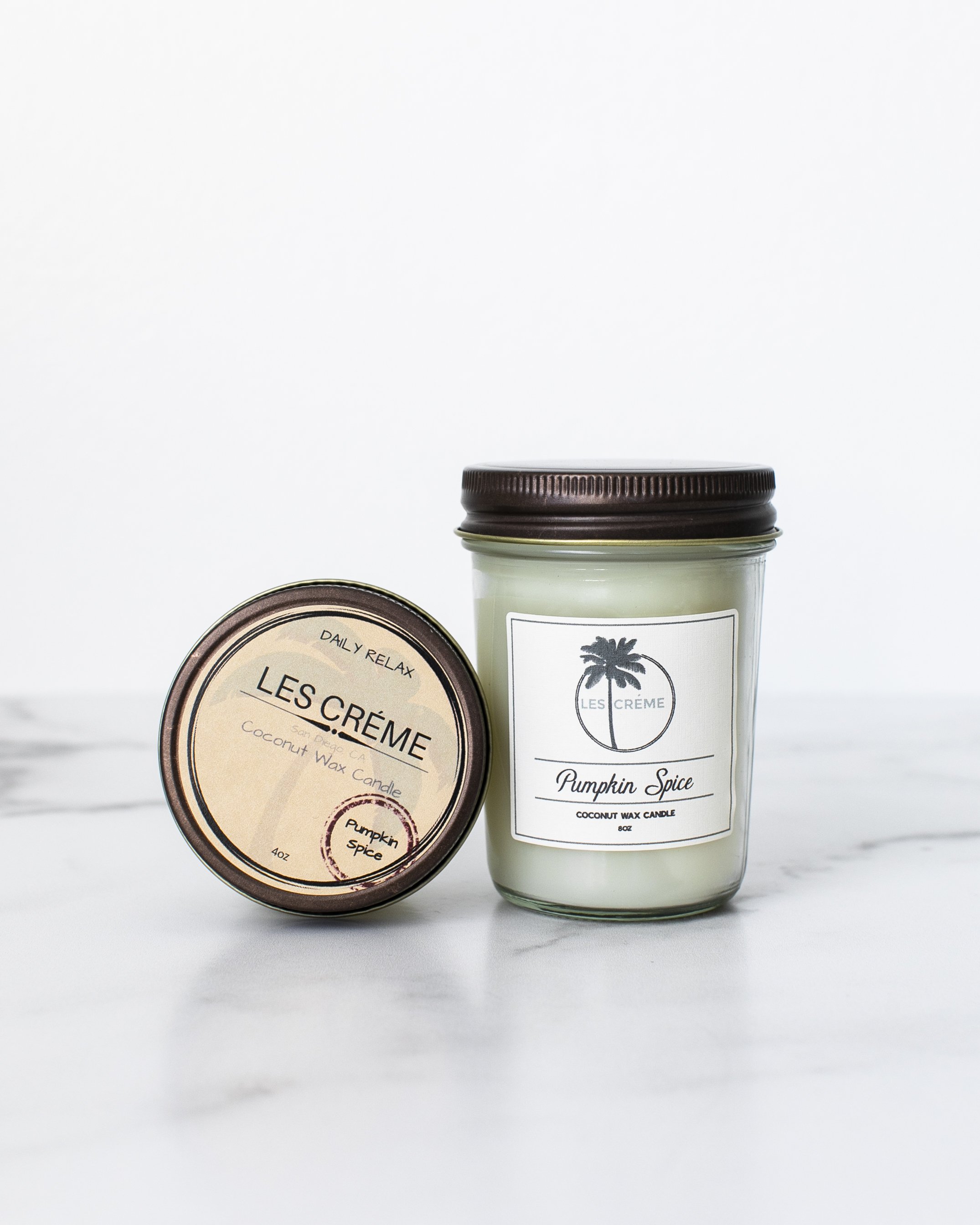 A beautifully crafted Pumpkin Spice Scent Coconut Wax Candle in a glass jar, showcasing its warm, inviting color and natural cotton wick.