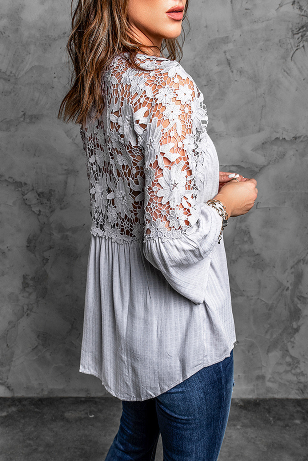 A stylish Purple Crochet Lace Button Top featuring intricate lace detailing, a v-neckline, and ¾ bell sleeves, perfect for various occasions.