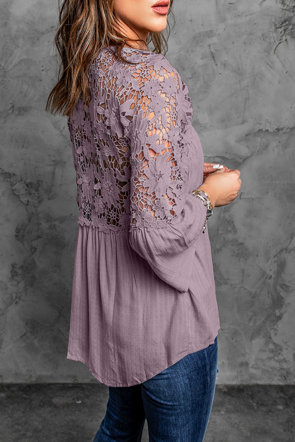 A stylish Purple Crochet Lace Button Top featuring intricate lace detailing, a v-neckline, and ¾ bell sleeves, perfect for various occasions.