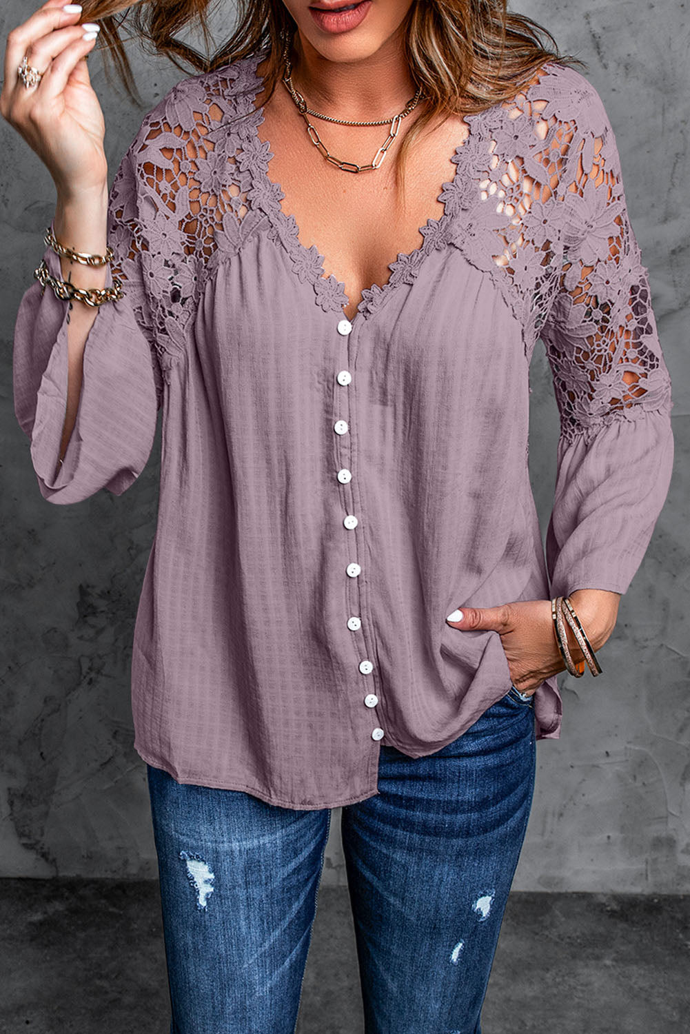 A stylish Purple Crochet Lace Button Top featuring intricate lace detailing, a v-neckline, and ¾ bell sleeves, perfect for various occasions.