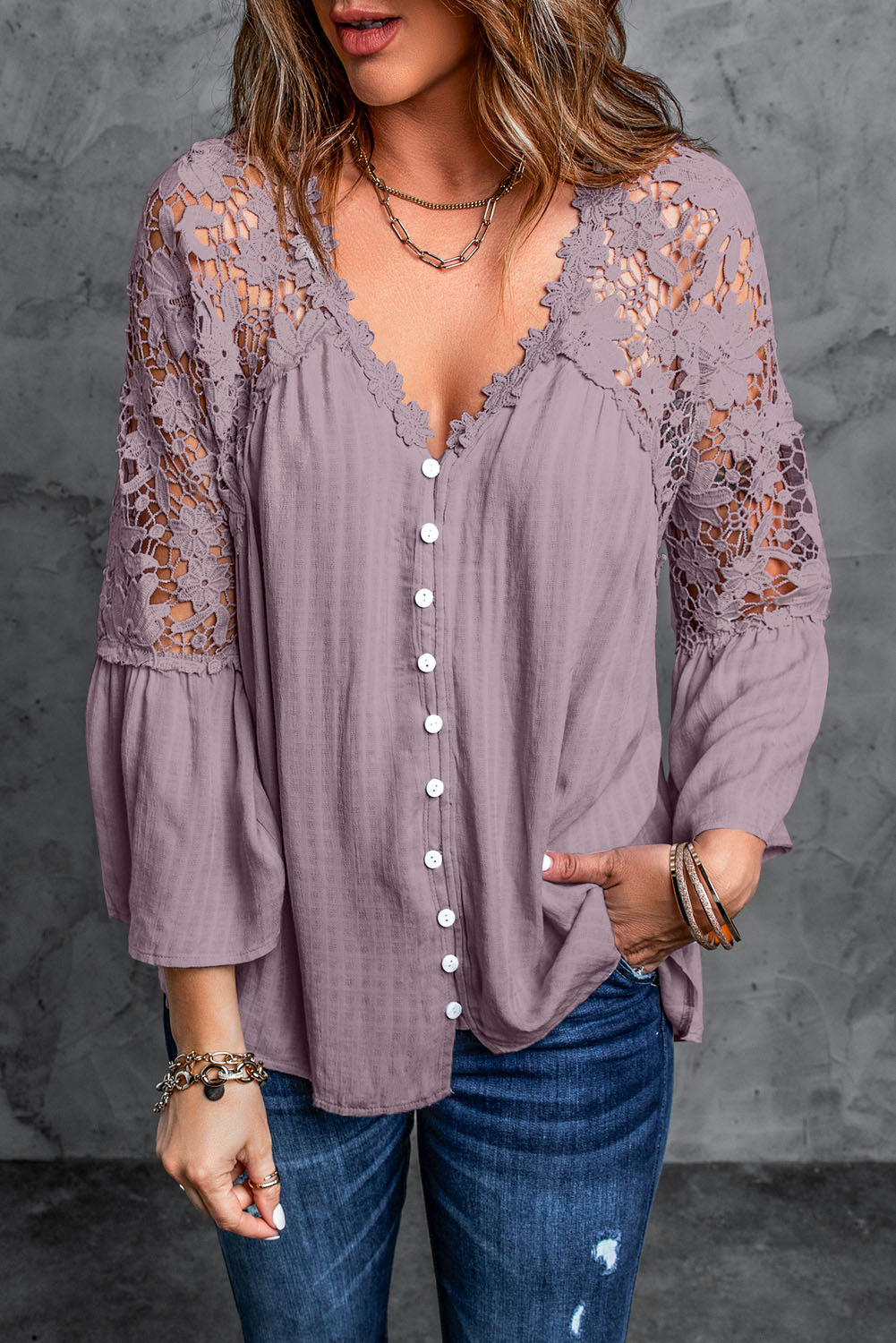 A stylish Purple Crochet Lace Button Top featuring intricate lace detailing, a v-neckline, and ¾ bell sleeves, perfect for various occasions.