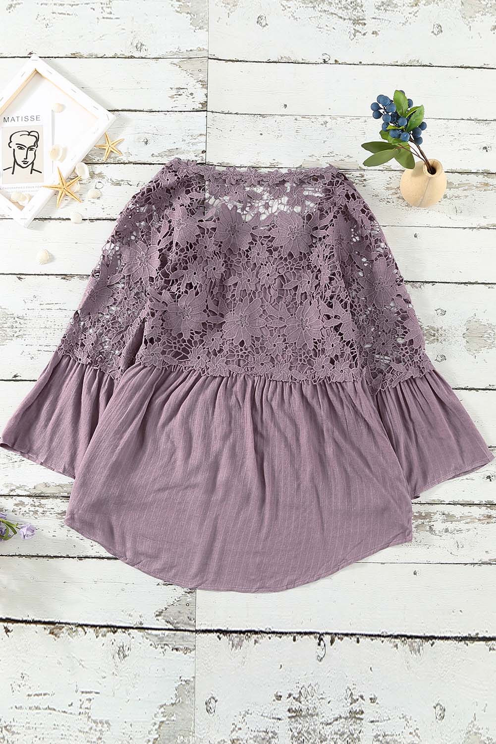 A stylish Purple Crochet Lace Button Top featuring intricate lace detailing, a v-neckline, and ¾ bell sleeves, perfect for various occasions.