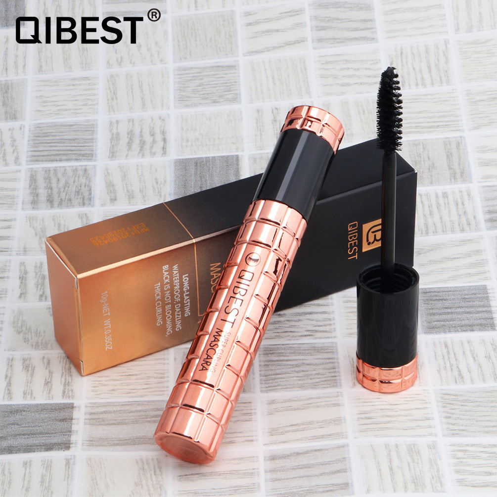 QIBEST Charming Curling Mascara showcasing its sleek packaging and brush design for curling lashes.