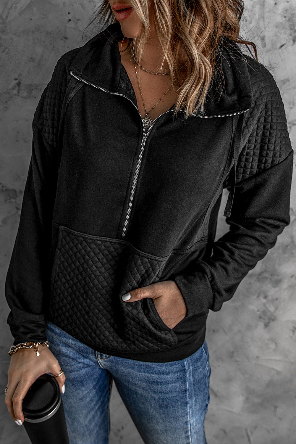 A stylish quilted patch half zipper sweatshirt in solid color, showcasing its unique texture and chic design.