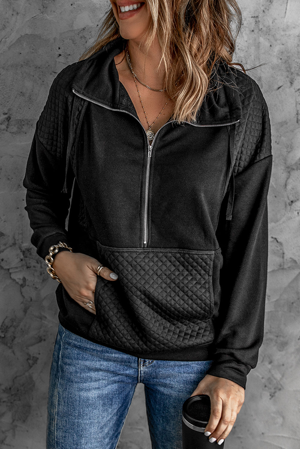 A stylish quilted patch half zipper sweatshirt in solid color, showcasing its unique texture and chic design.