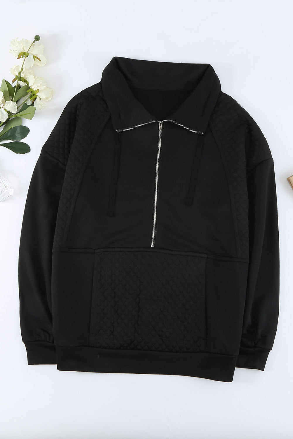 A stylish quilted patch half zipper sweatshirt in solid color, showcasing its unique texture and chic design.