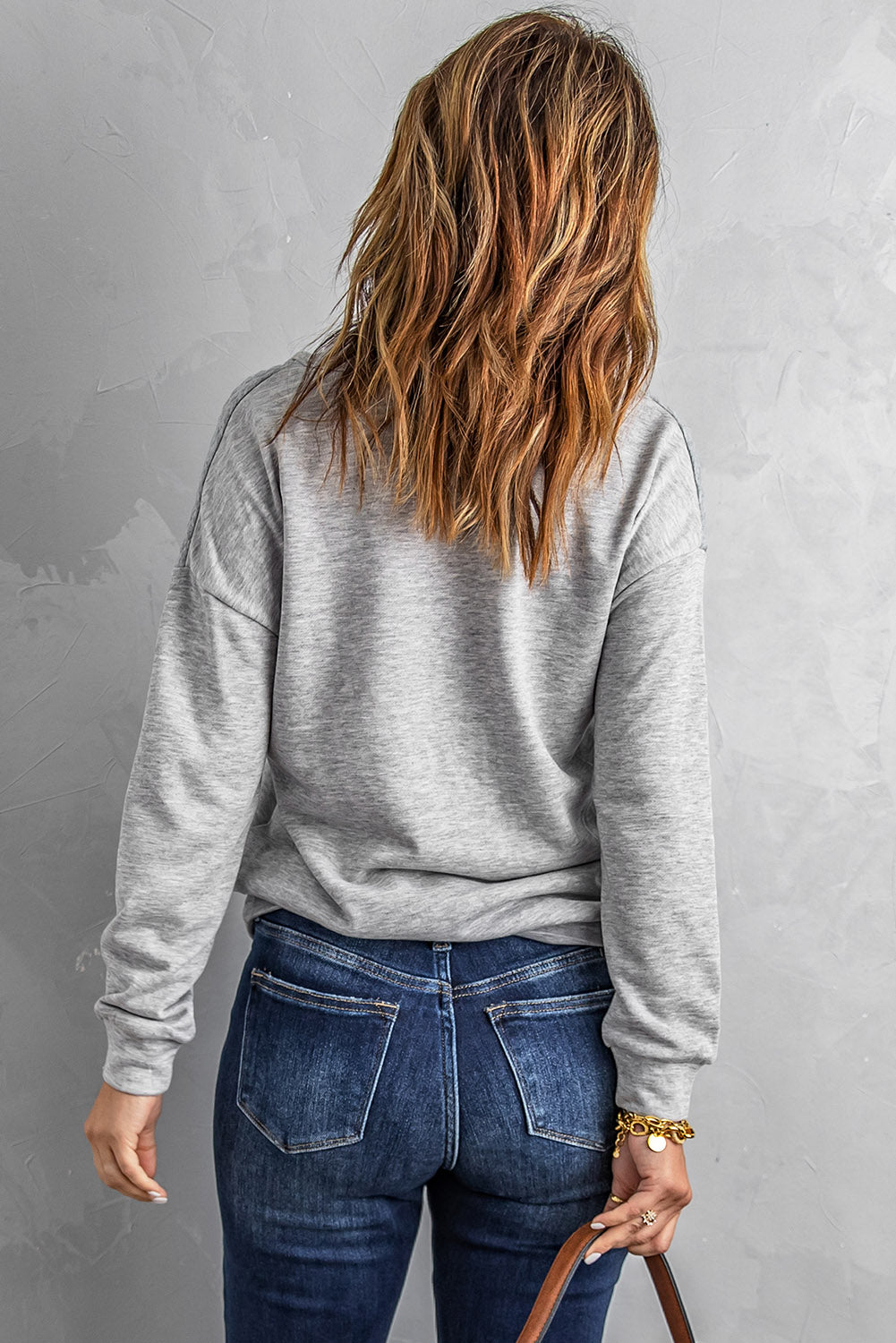 A stylish quilted patch half zipper sweatshirt in solid color, showcasing its unique texture and chic design.