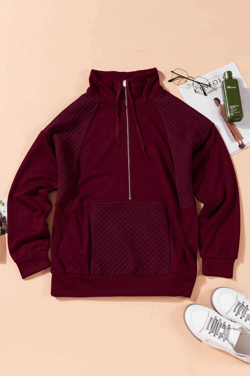 A stylish quilted patch half zipper sweatshirt in solid color, showcasing its unique texture and chic design.