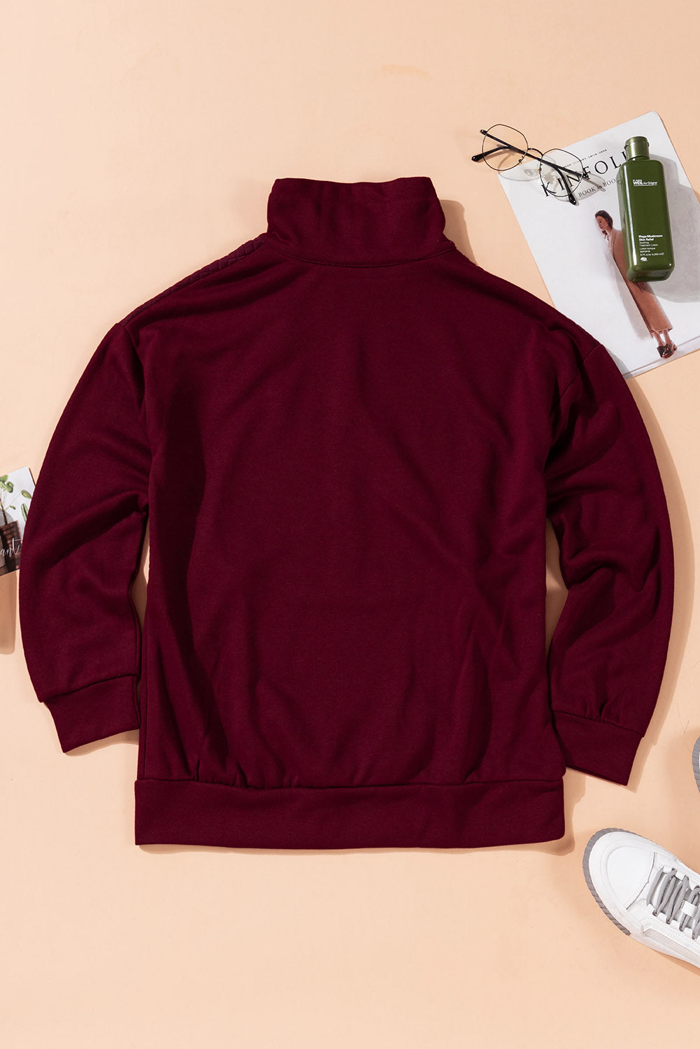 A stylish quilted patch half zipper sweatshirt in solid color, showcasing its unique texture and chic design.