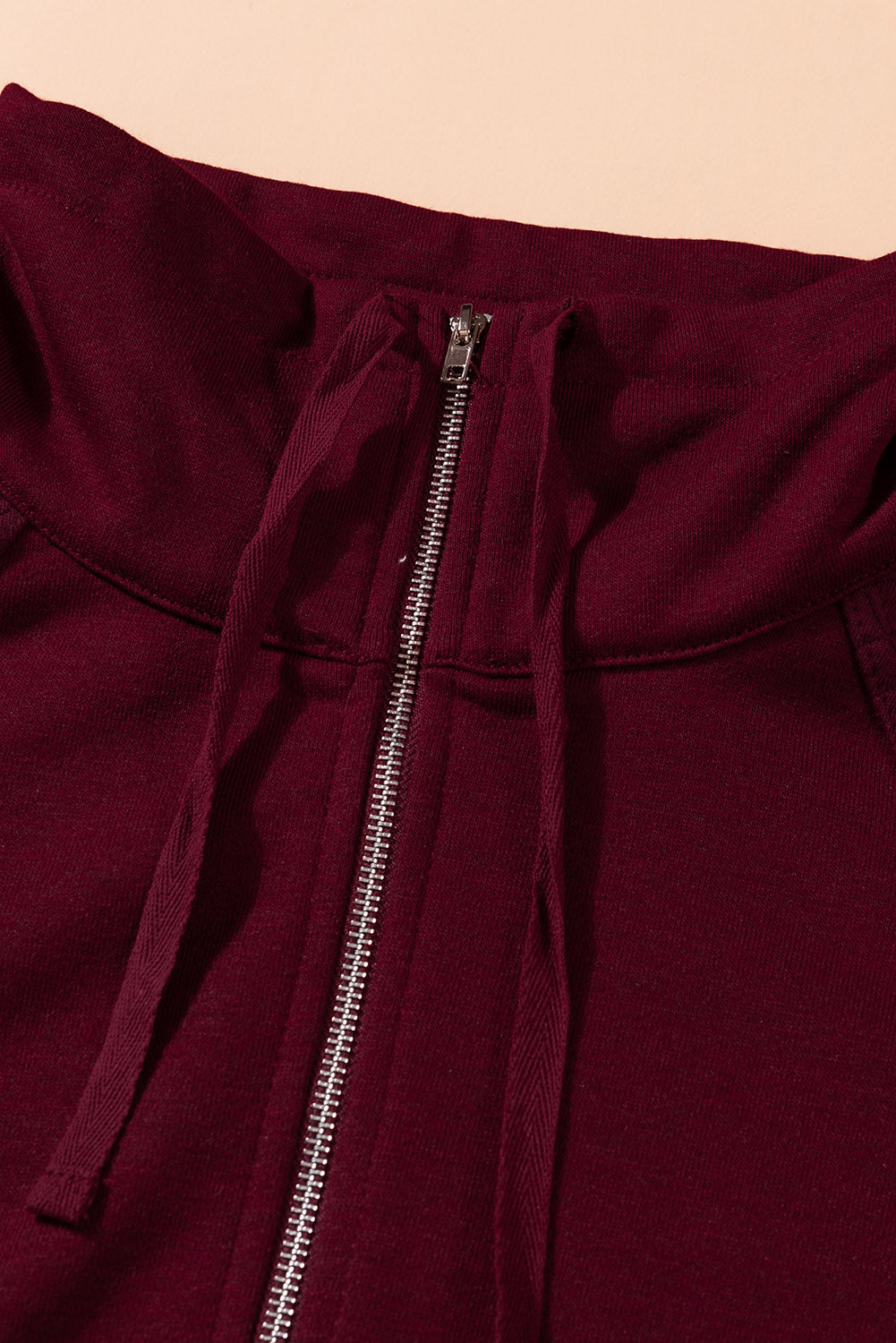 A stylish quilted patch half zipper sweatshirt in solid color, showcasing its unique texture and chic design.