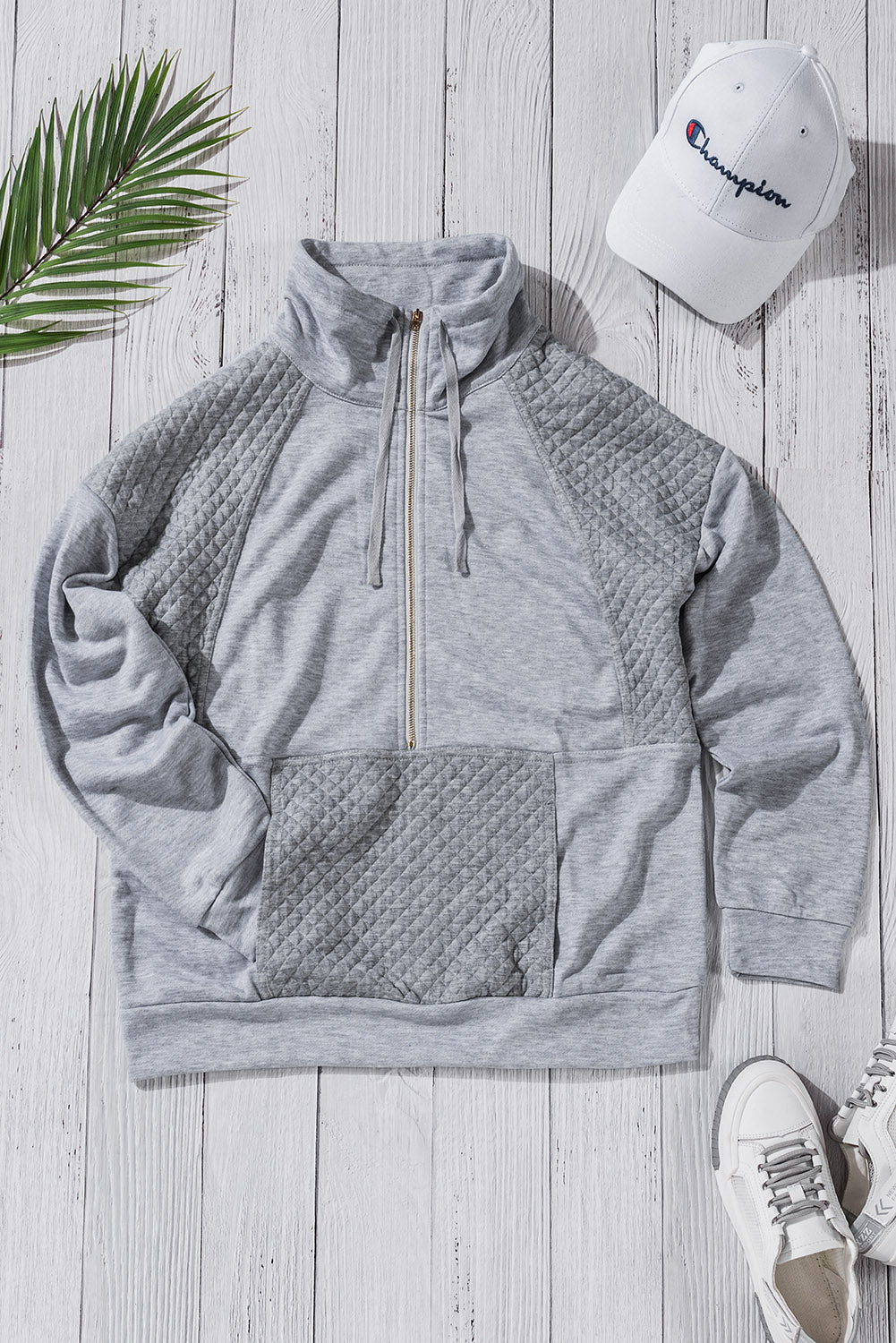 A stylish quilted patch half zipper sweatshirt in solid color, showcasing its unique texture and chic design.