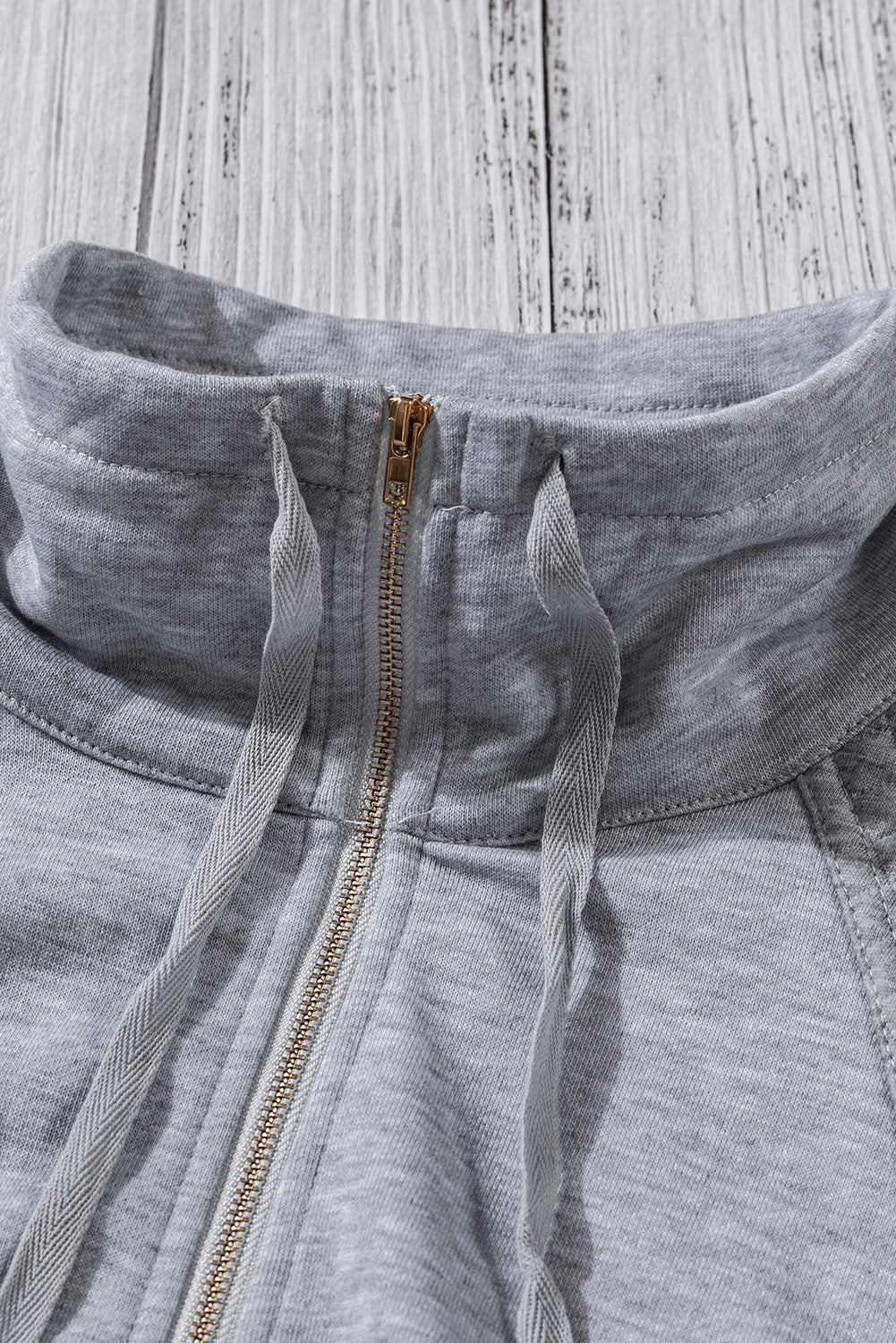 A stylish quilted patch half zipper sweatshirt in solid color, showcasing its unique texture and chic design.