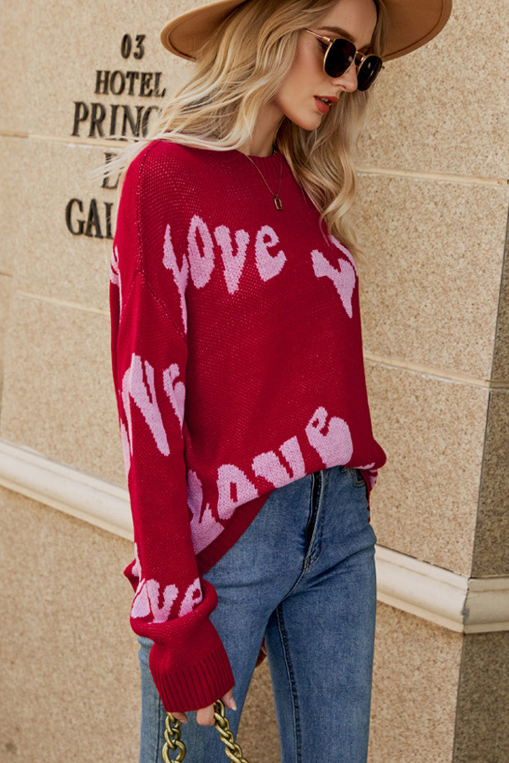 Racing Red Groovy LOVE Slouchy Sweater featuring a relaxed fit and eye-catching LOVE graphic, perfect for casual wear.