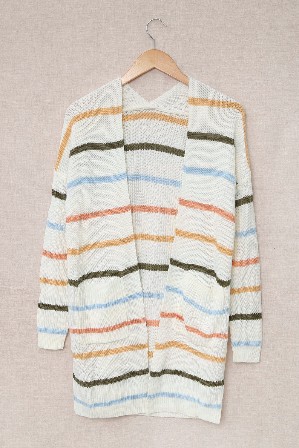 A cozy Rainbow Striped Cardigan featuring vibrant colors and a soft texture, perfect for layering in any season.