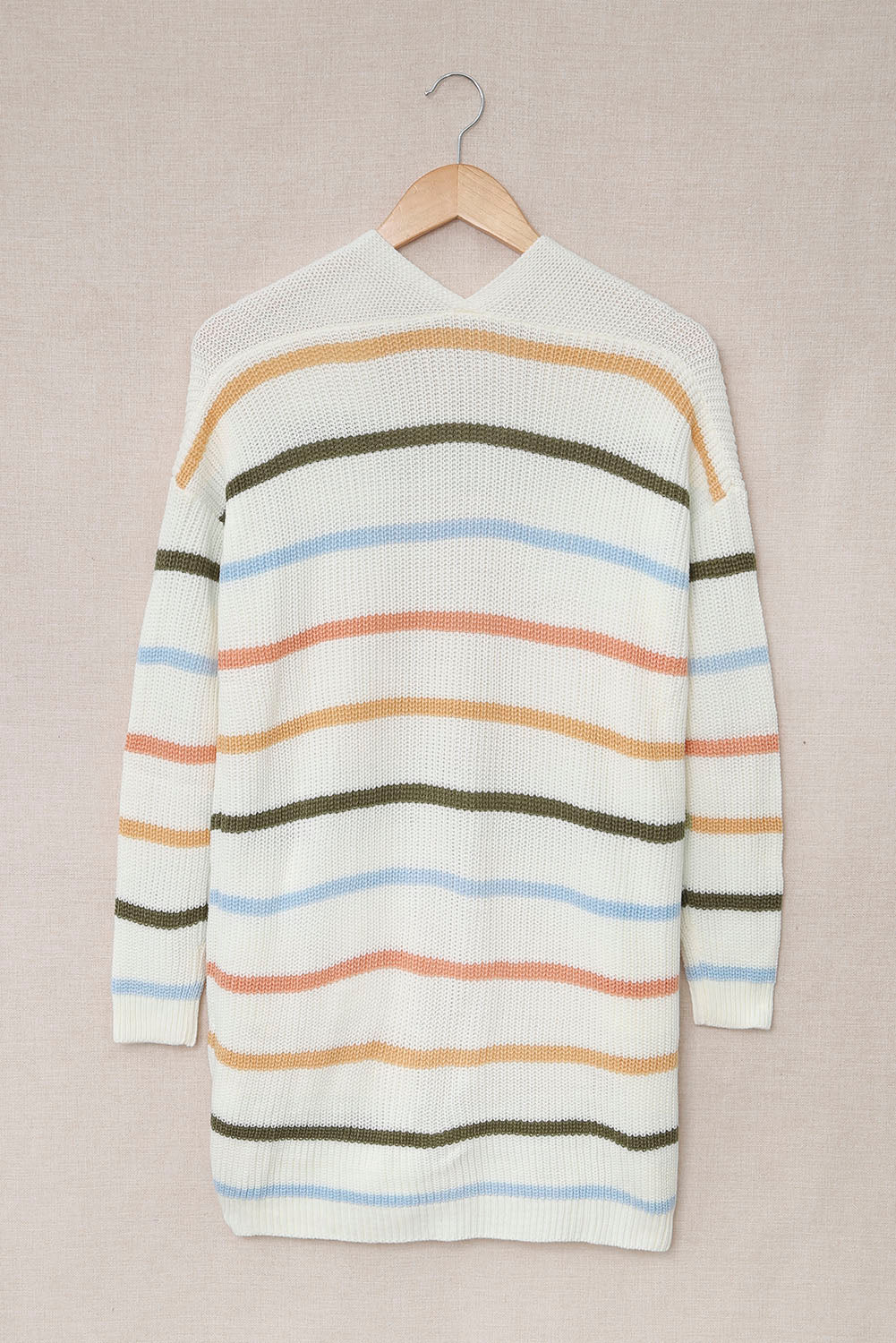 A cozy Rainbow Striped Cardigan featuring vibrant colors and a soft texture, perfect for layering in any season.