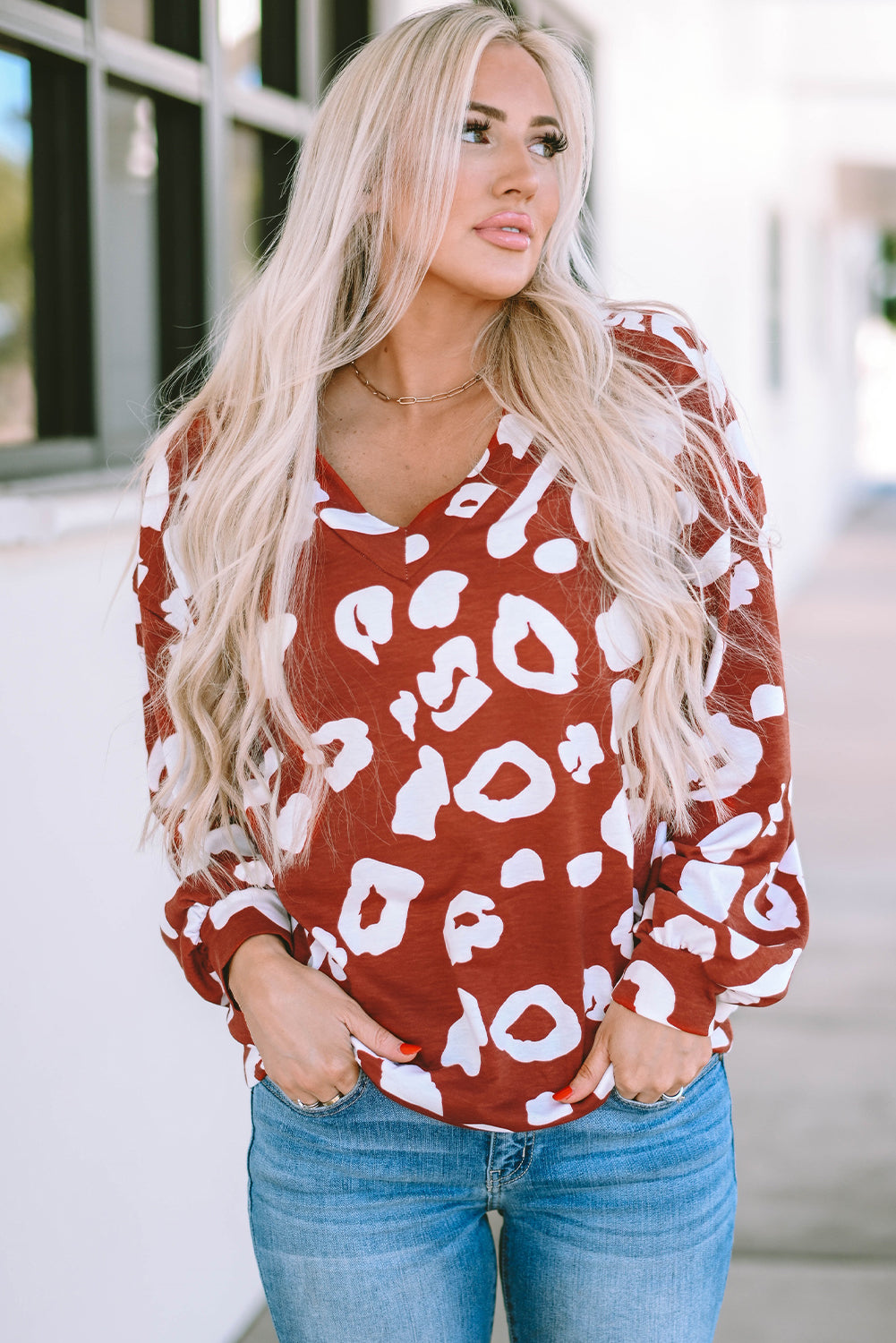 Red Clay Leopard Print Bishop Sleeve V-Neck Top featuring a relaxed fit and stylish puff sleeves, perfect for casual wear.