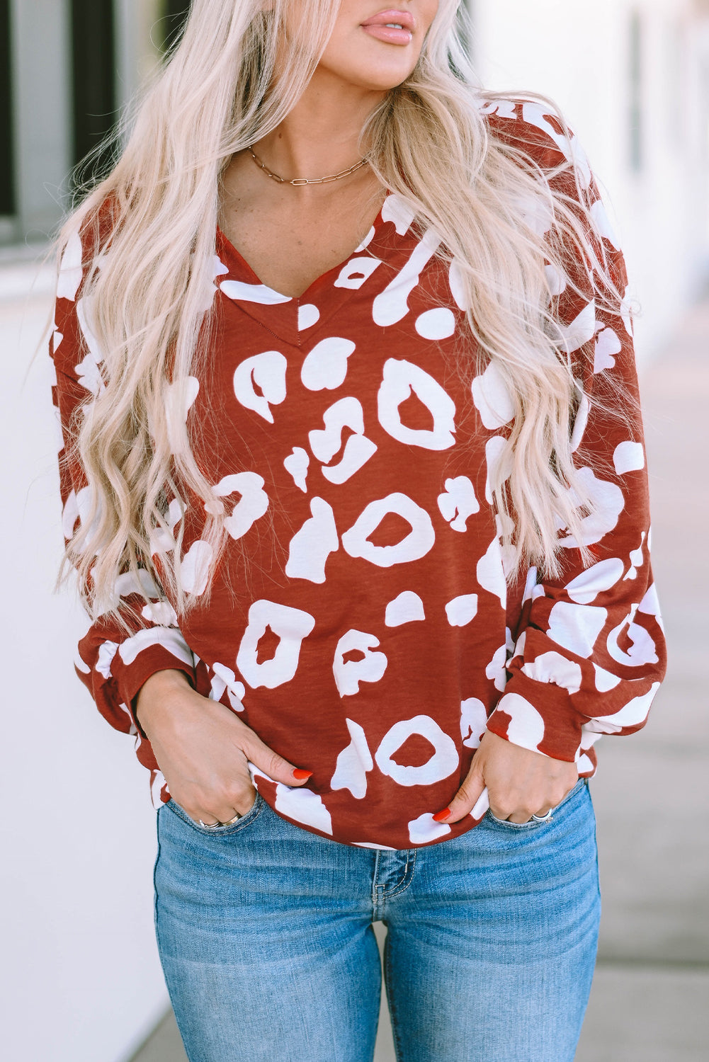 Red Clay Leopard Print Bishop Sleeve V-Neck Top featuring a relaxed fit and stylish puff sleeves, perfect for casual wear.