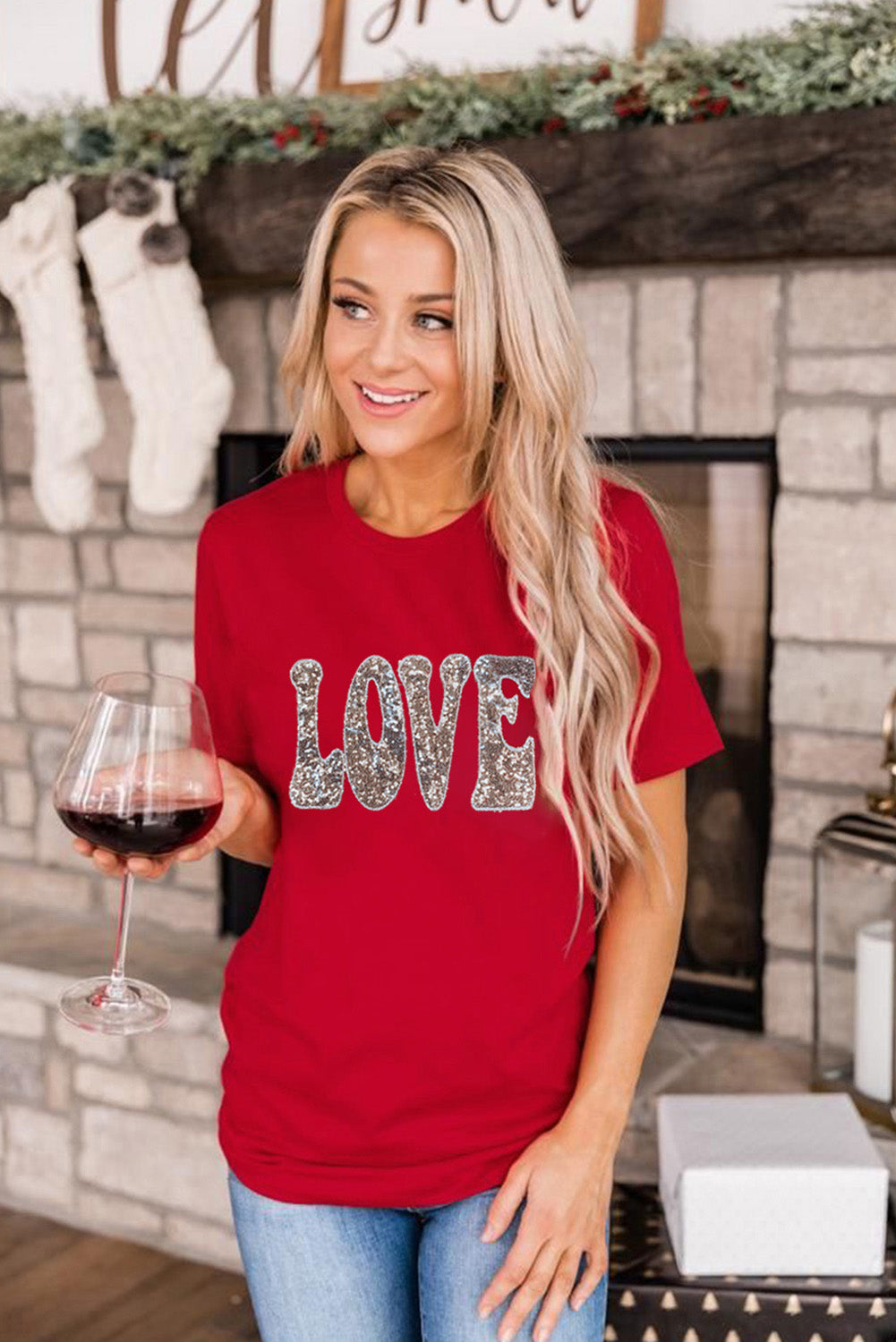 A vibrant red T-shirt featuring a sequined 'LOVE' design, perfect for Valentine's Day and summer wear.