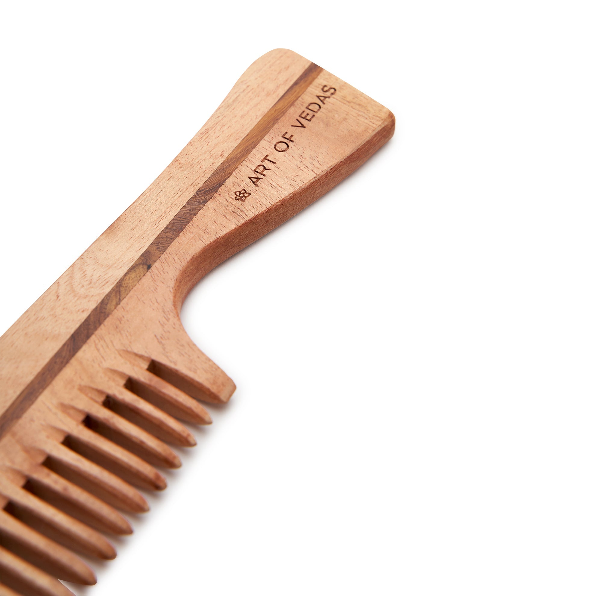 Regular Essentials Comb made from premium Neem wood, featuring wide-spaced teeth and unique handcrafted grain patterns.