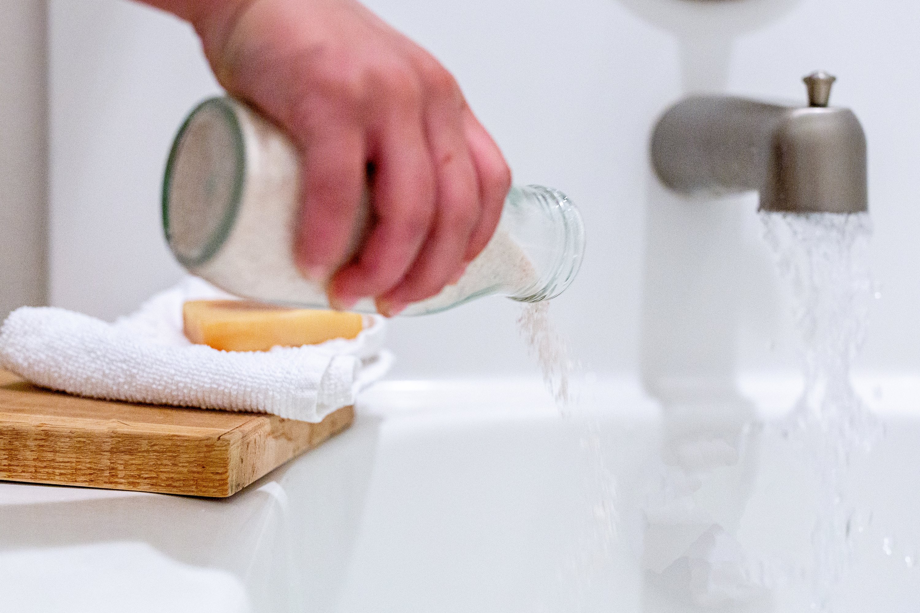 A serene bath setting featuring RELAX Coconut Milk Bath Soak with pink Himalayan salt and essential oils, promoting relaxation and skin nourishment.