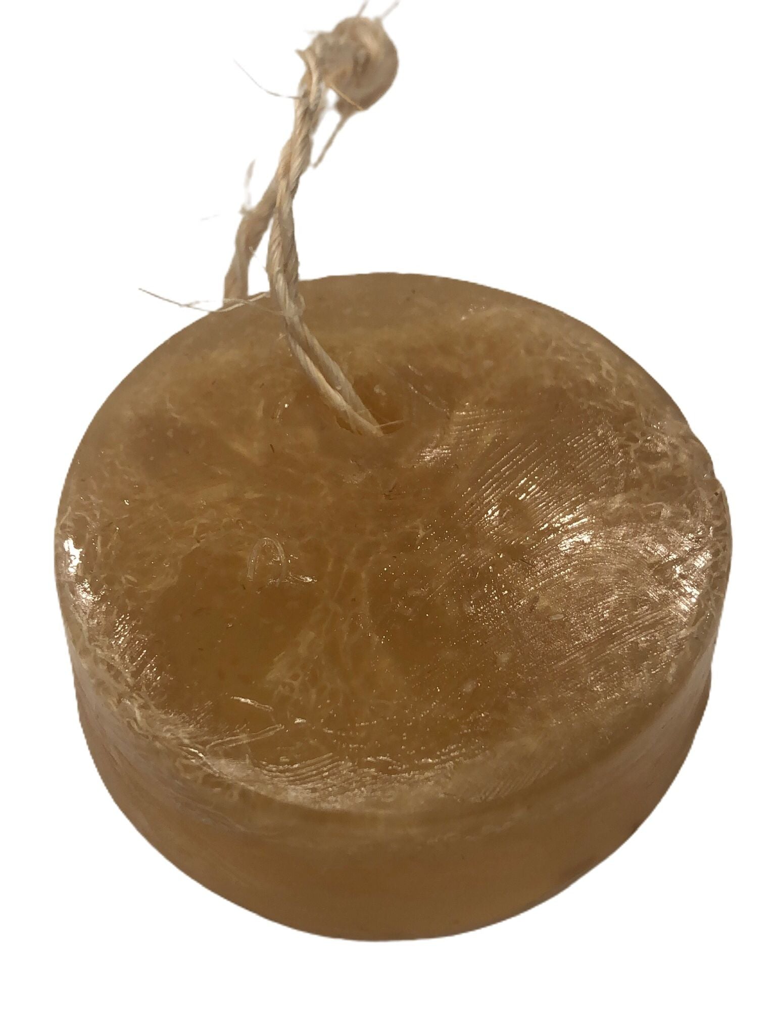 Restorative Soap Bar featuring oat, honey, and olive oil with a natural loofah for exfoliation, displayed elegantly.