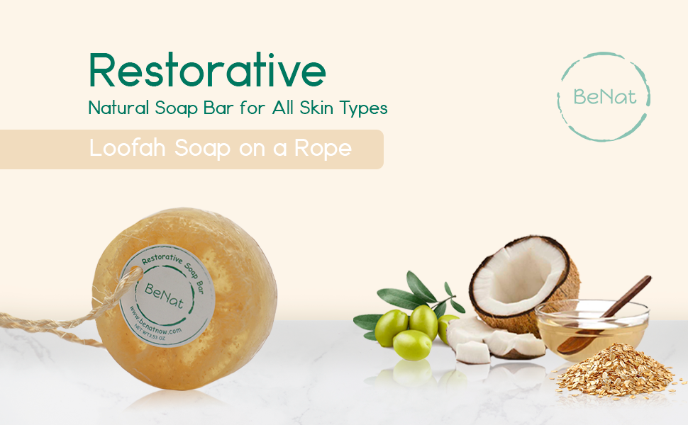 Restorative Soap Bar featuring oat, honey, and olive oil with a natural loofah for exfoliation, displayed elegantly.