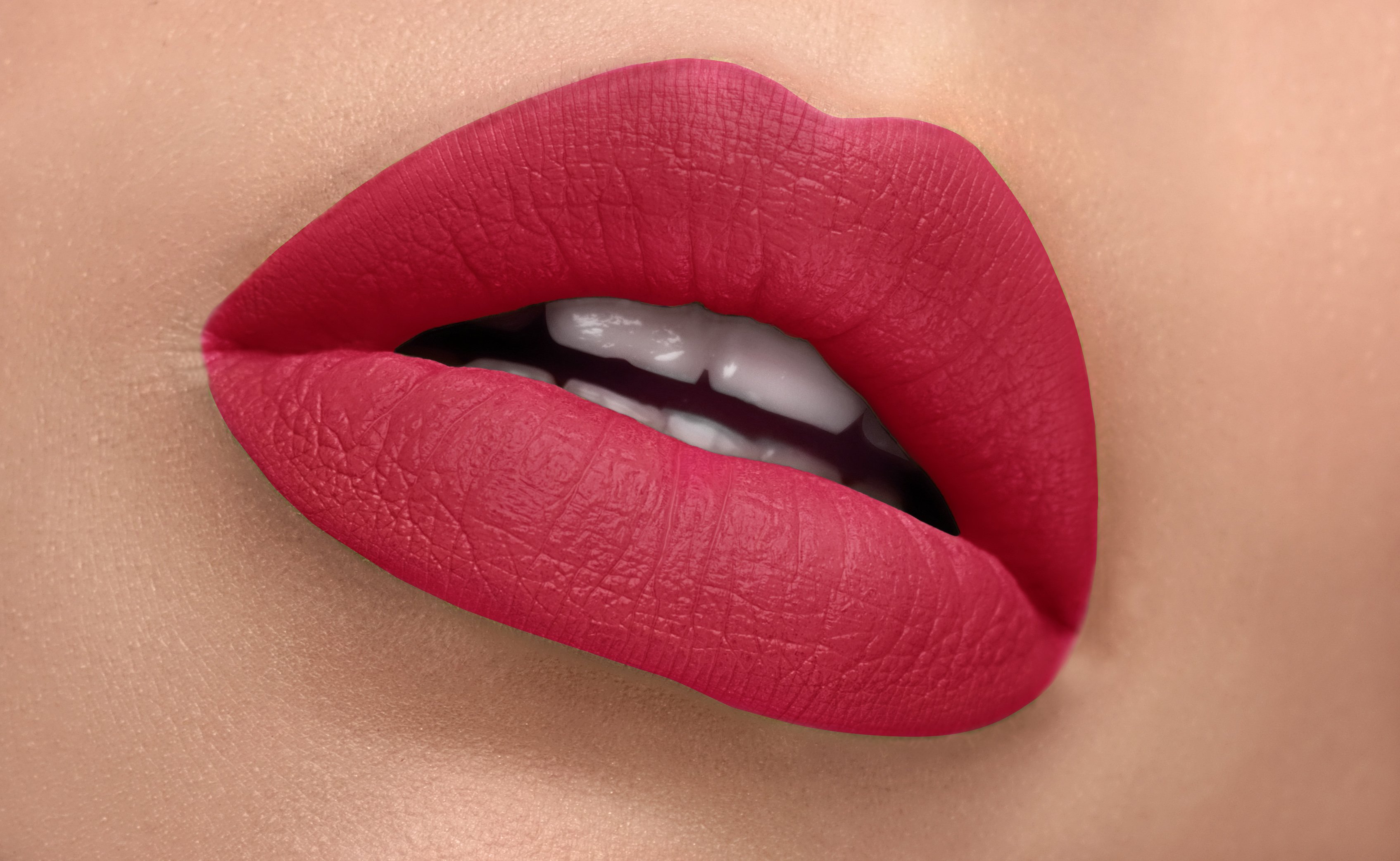 A close-up of Retro Silk-Matte Lipstick in Rose Pink, showcasing its smooth texture and vibrant color in a sleek tube.