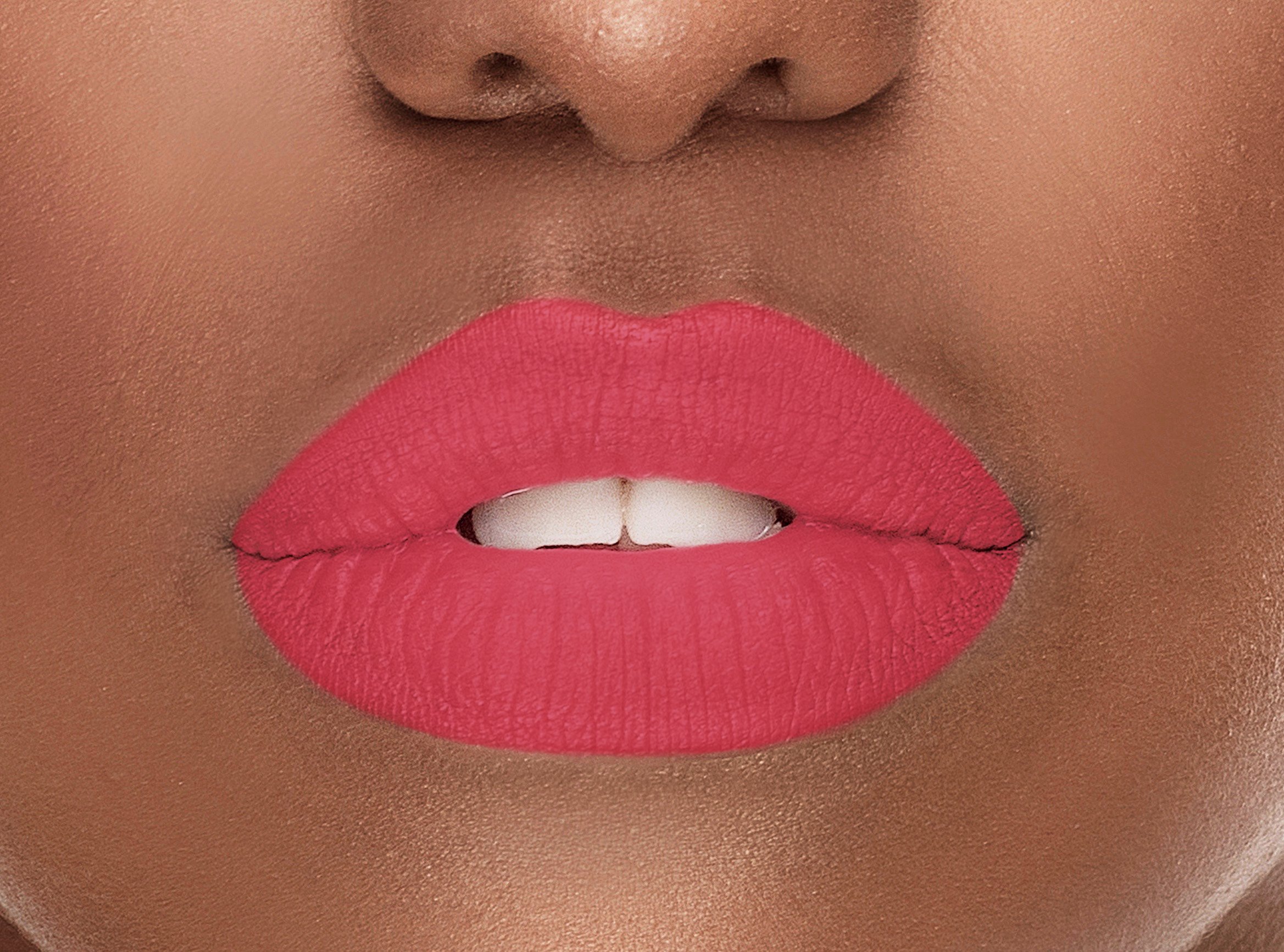 A close-up of Retro Silk-Matte Lipstick in Rose Pink, showcasing its smooth texture and vibrant color in a sleek tube.